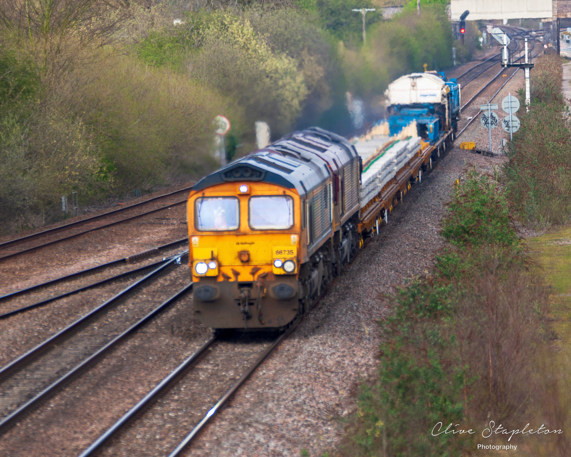 Willington, Derby, UK, April,1,2021:Double Headed Class 66 No 66735 + another on the 6G45 Toton North Yard to Bescot Up Engineers Sdgs Gbrf at North Stafford Junction Willington, Derbyshire
