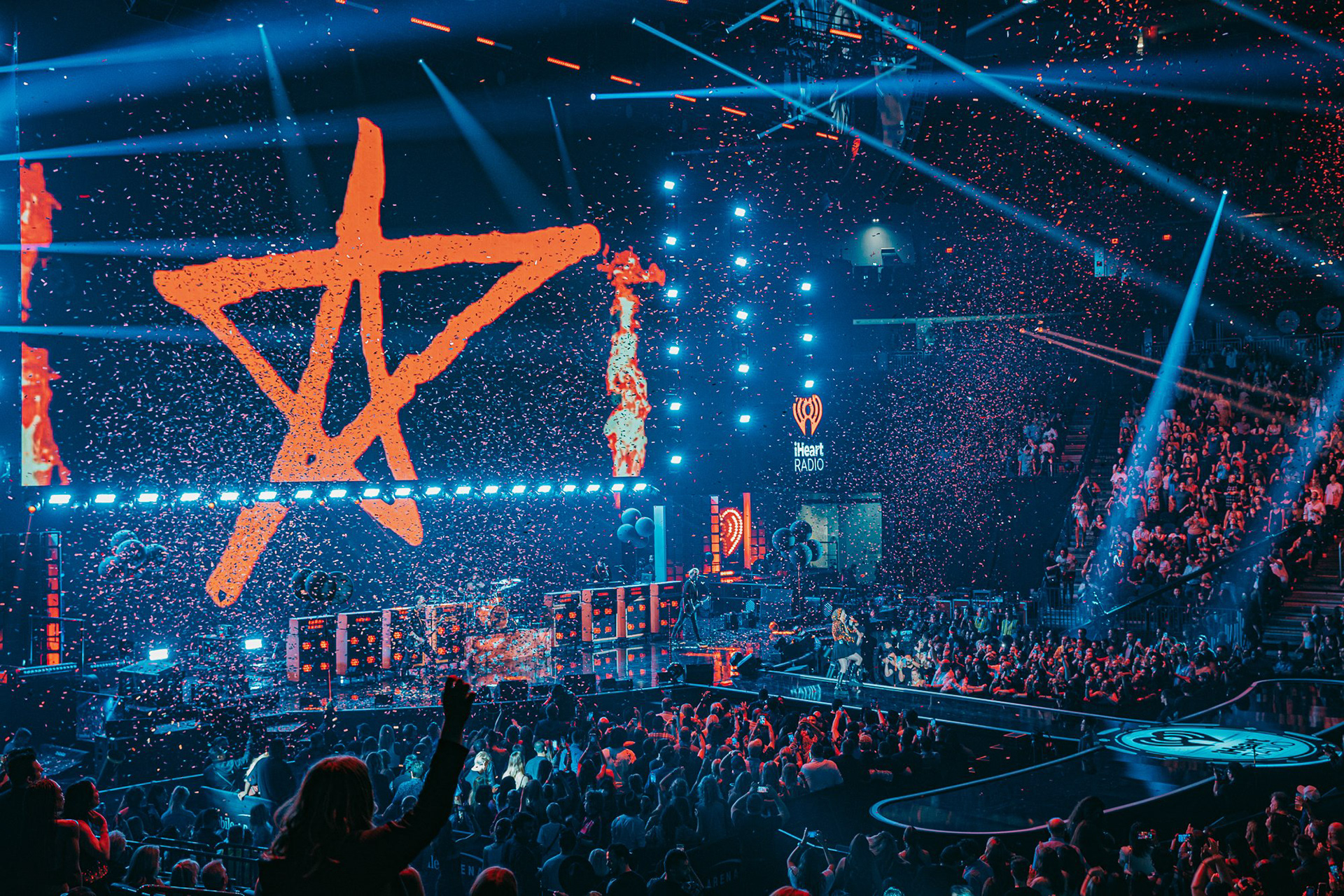 A high-energy moment during Avril Lavigne’s set at the 2022 iHeartRadio Music Festival. Capturing the 'hero' confetti burst over the crowd at T-Mobile Arena.