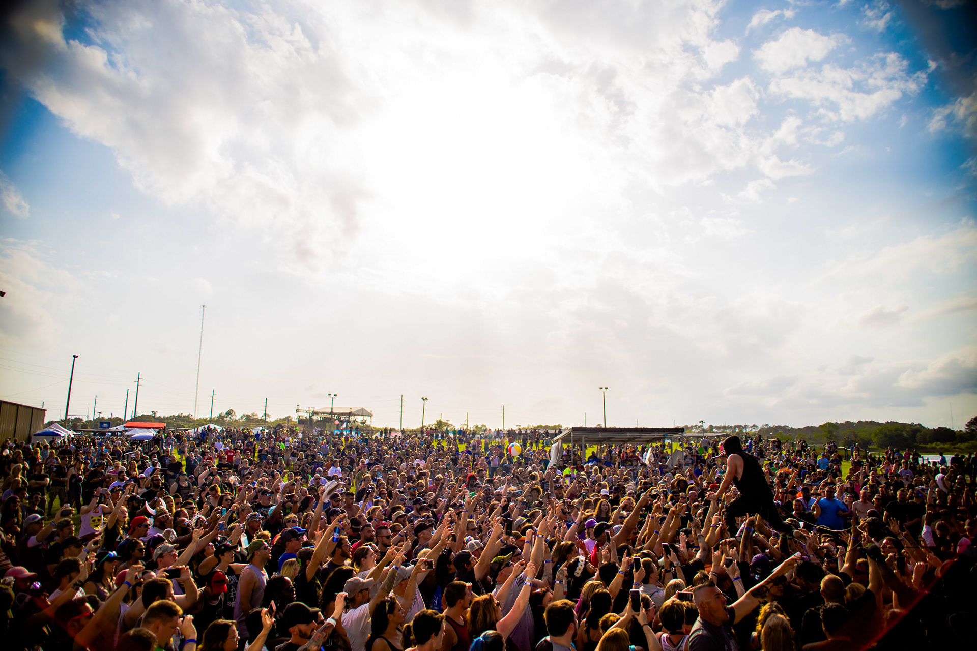 April 2018 - Direct engagement captured from the stage. Jesse Hasek of 10 Years connects with the festival crowd during a high-energy set at the Orlando Amphitheater’s Earth Day Birthday.