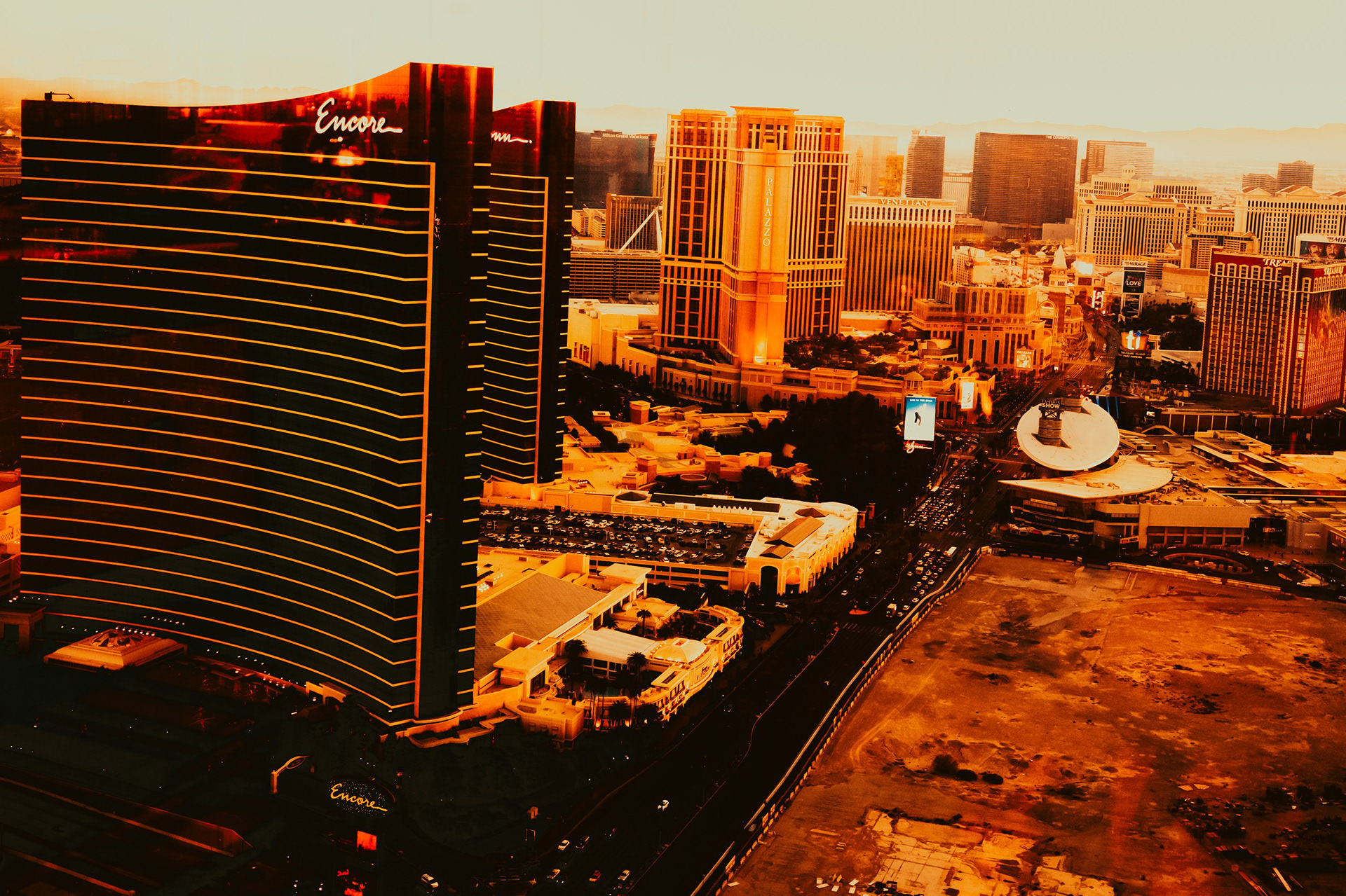 December 2022 - Sunset over the Las Vegas Strip featuring the Encore Hotel and others in the distance from the Alle 66 Lounge at Resorts World.