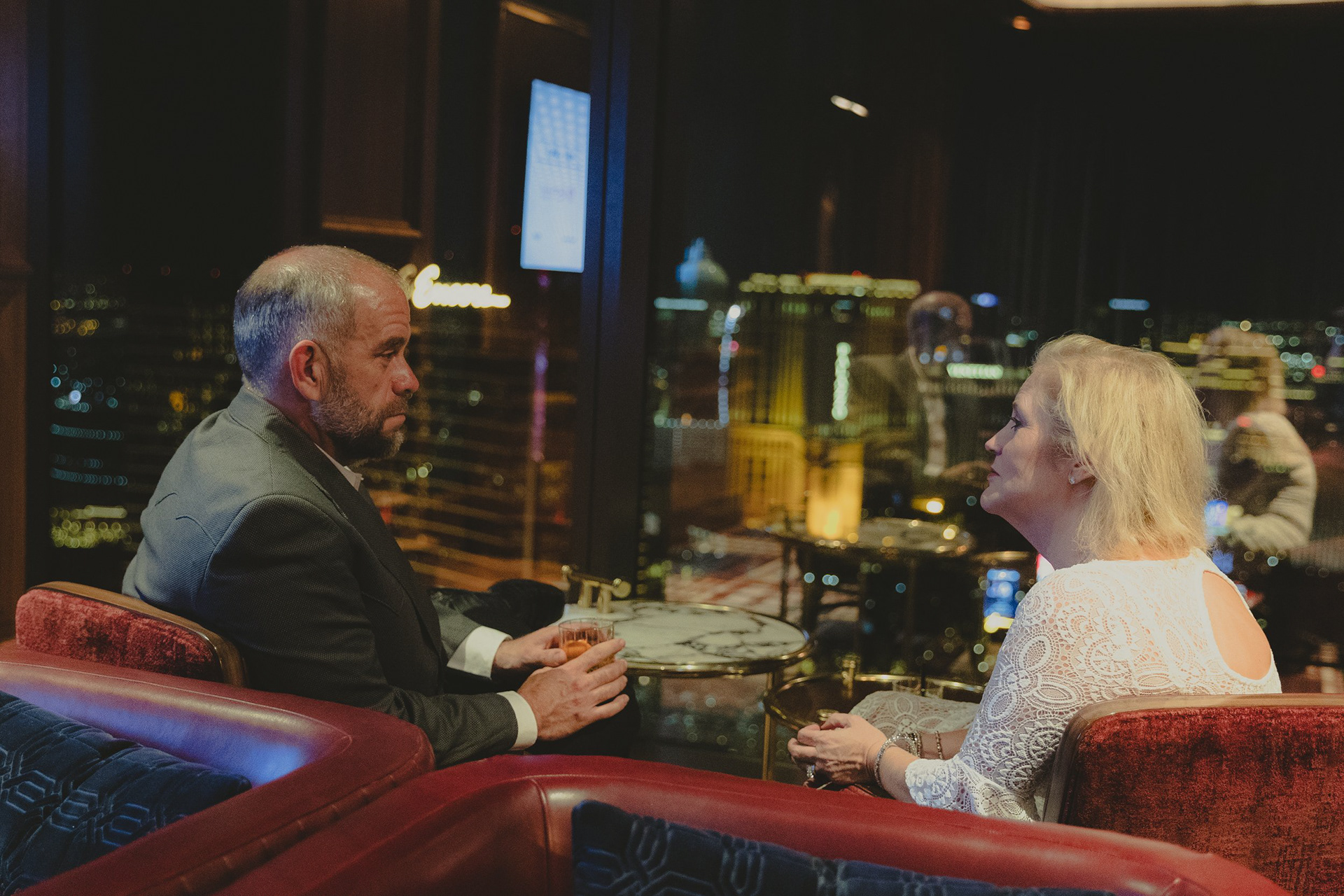 Private event coverage at Alle 66, Resorts World. A couple enjoying the Las Vegas skyline during a high-end corporate hospitality evening.
