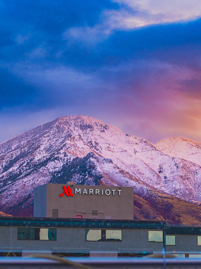 February 2025 - Snowcapped mountains featuring a Marriott International hotel during sunset in Provo, Utah. Photo: Savannah Lee Rowley