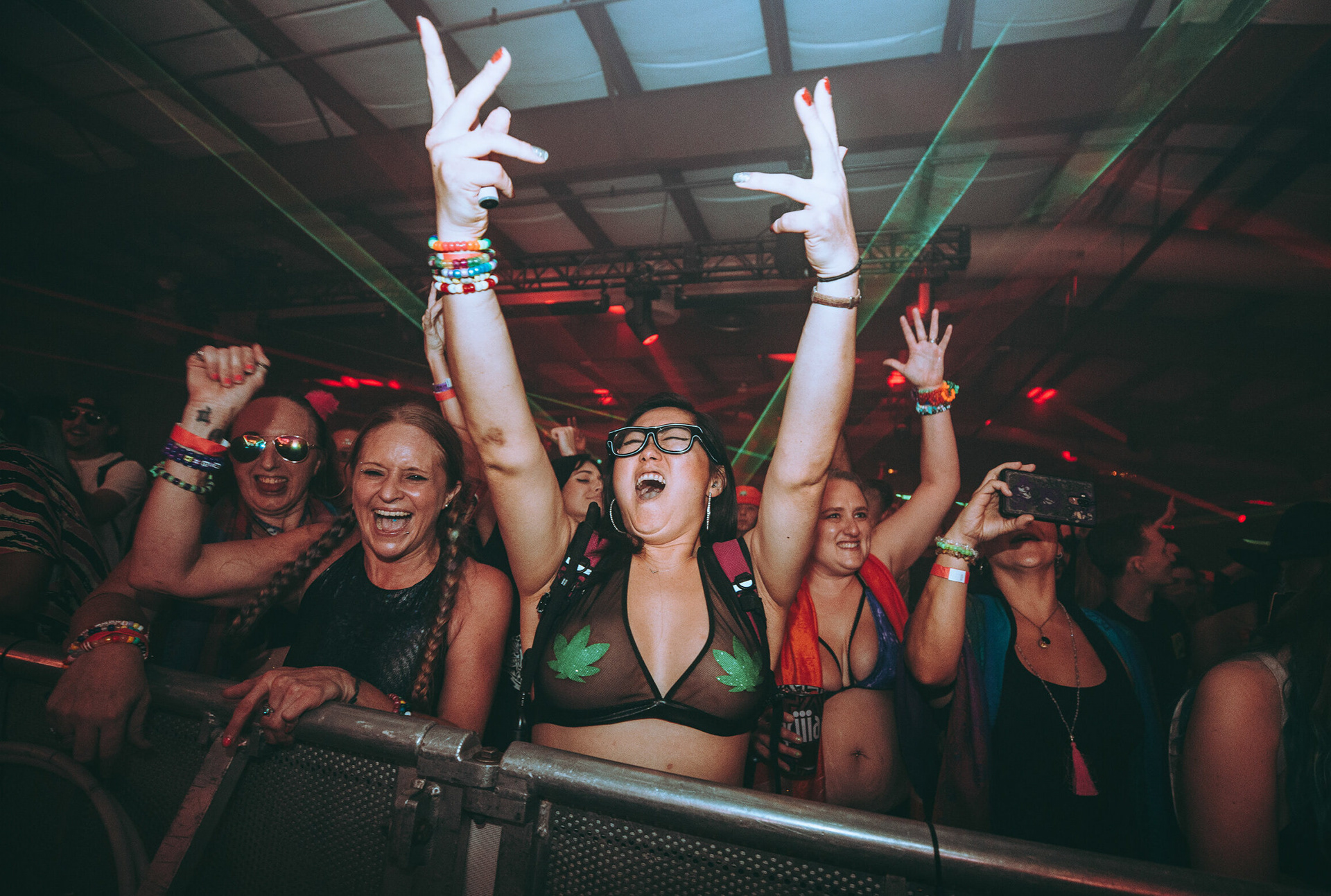 Atmospheric portraiture at the Endless Summer Music Festival. Capturing the moment of immersion at the Orlando Warehouse and Amphitheater, focusing on the intersection of light, sound, and audience connection