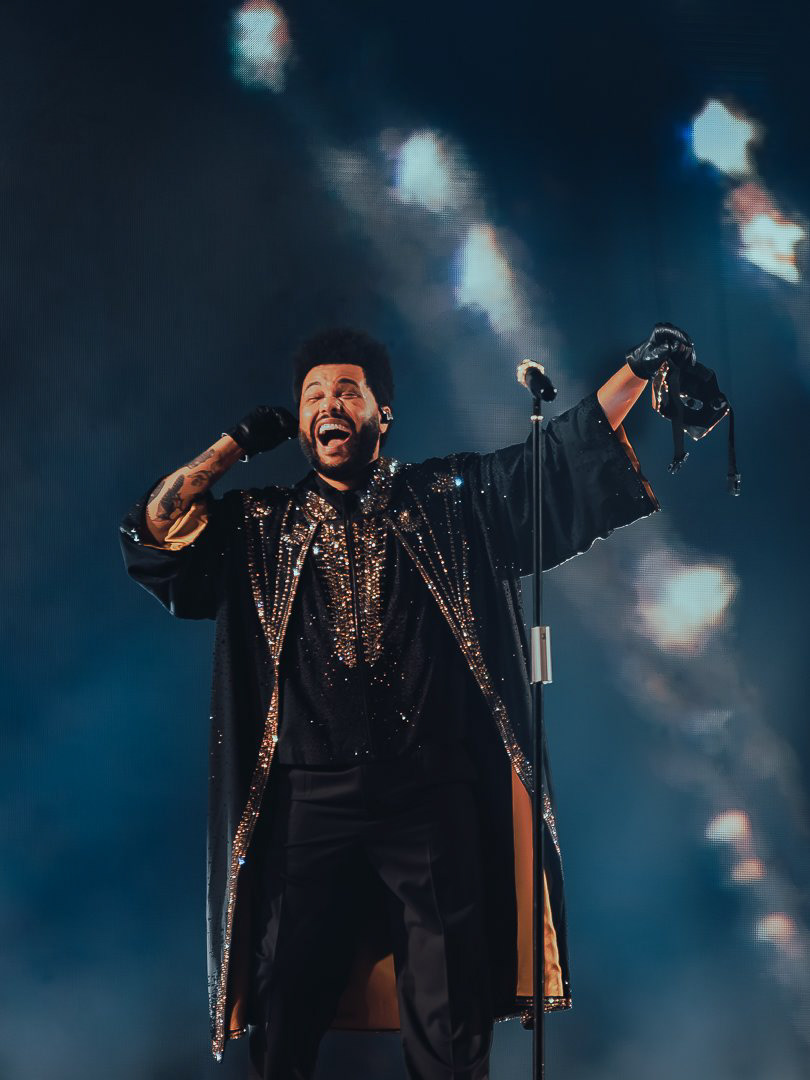 July 2025 - The Weeknd (Abel Tesfaye) removing his mask and revealing his face to 50,000 fans at Allegiant Stadium, marking a dramatic shift in the narrative of the 'After Hours Til Dawn' stadium tour.
