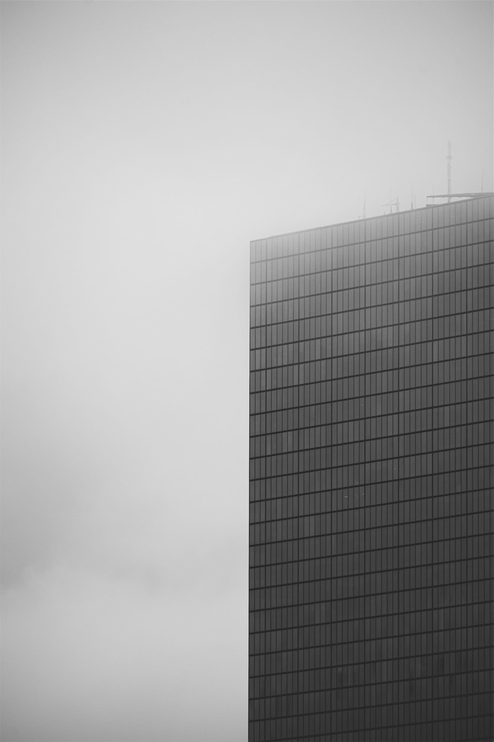 A monolith fading gently into the cloud, reminding us how even giants can dissolve into silence.