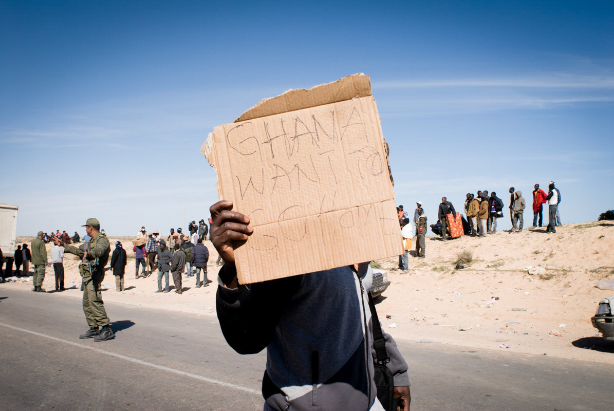 Un réfugié ghanéens lors d'une manifestation