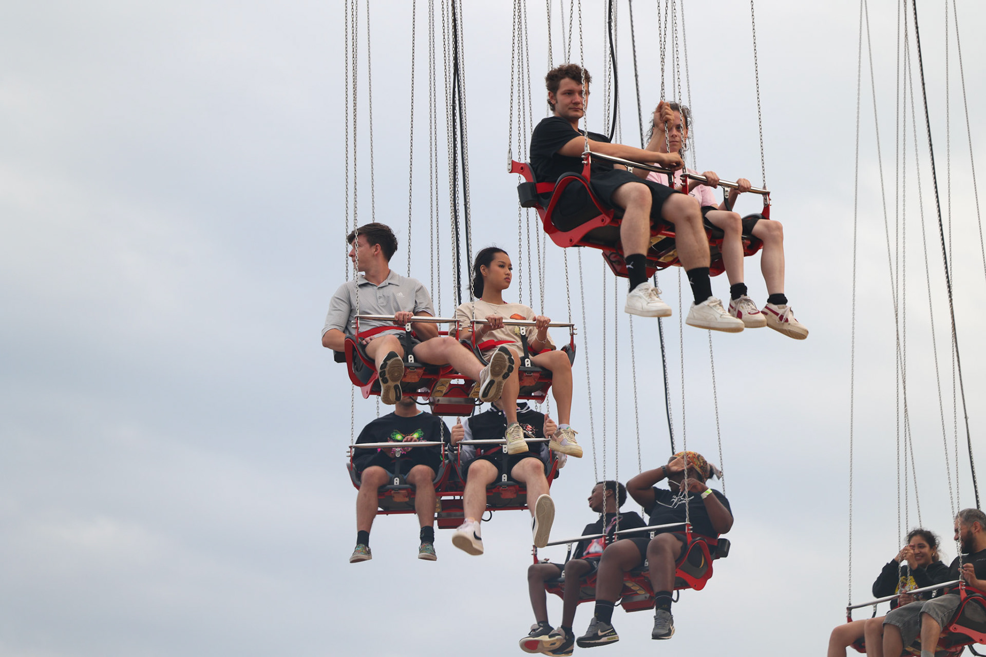 Parkgoers ride the SUPERGIRL Sky Flight attraction at Six Flags Fiesta Texas in San Antonio on Sept. 6, 2025.