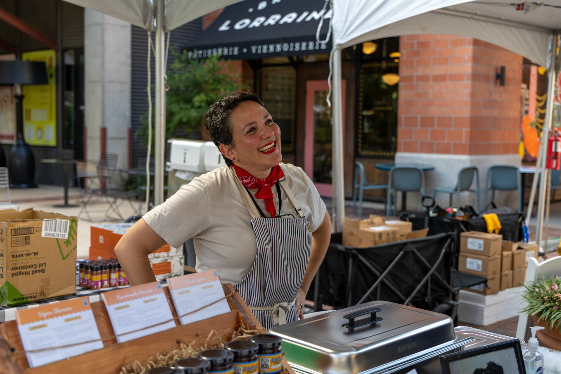 Maria Flores of Hess Street Foods greets customers at her booth during the Quest for Texas Best showcase at the Pearl on Sept. 24, 2025.