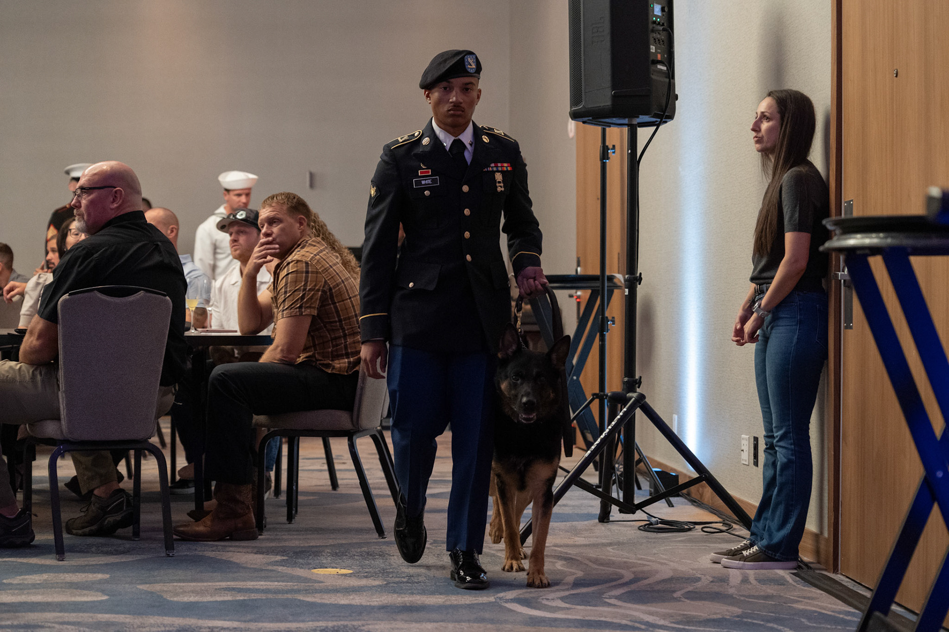 U.S. Army Spc. Devin White walks military working dog Balansy along the side of the ballroom before a ceremony honoring fallen K-9 teams at the U.S. War Dogs Association’s 25th anniversary event Friday, Oct. 17, 2025, at the Plaza San Antonio Hotel &amp; Spa.