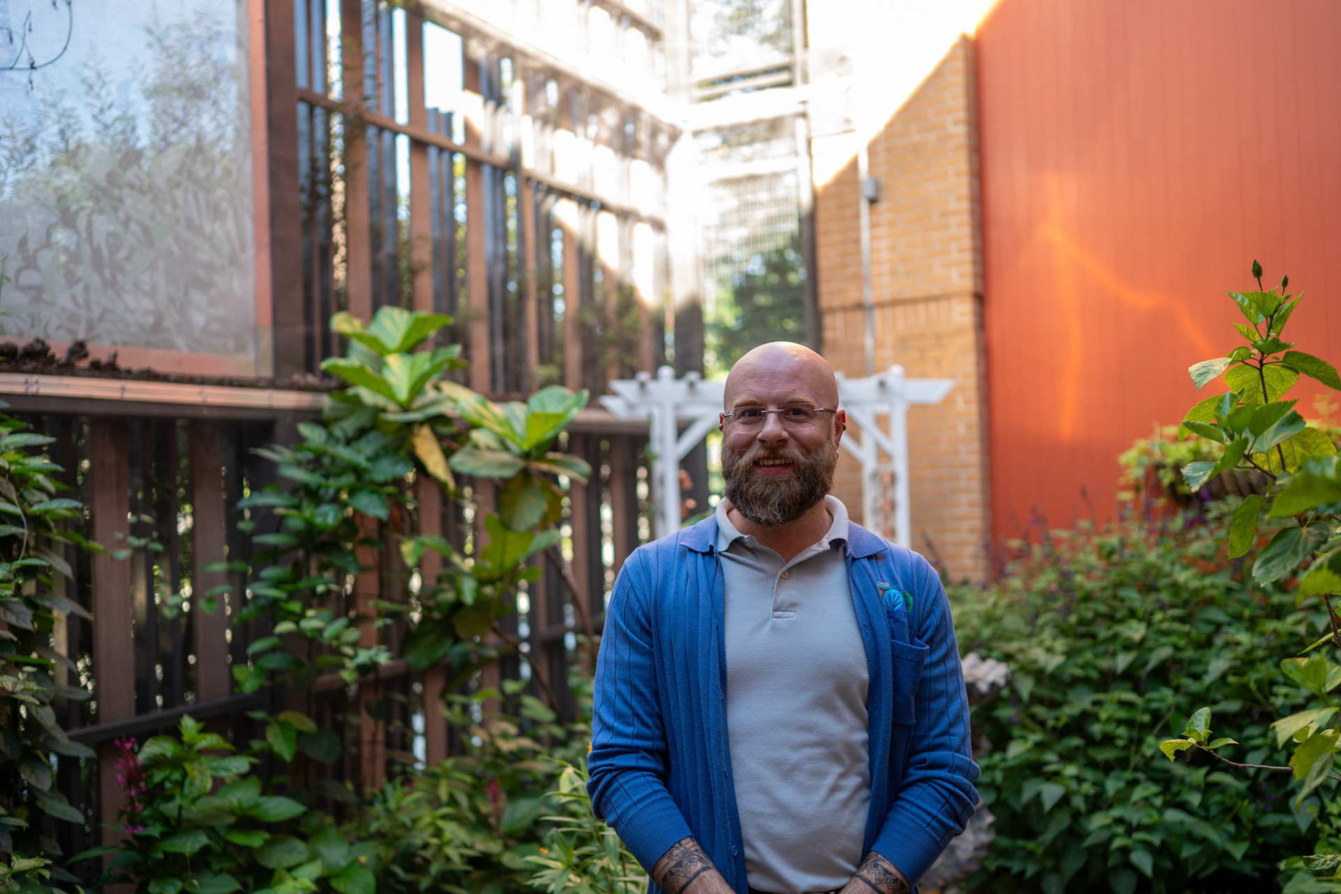 Zachary Stingl, director of the Will Smith Zoo School, poses for a portrait in the school’s butterfly garden in San Antonio on June 17, 2025.