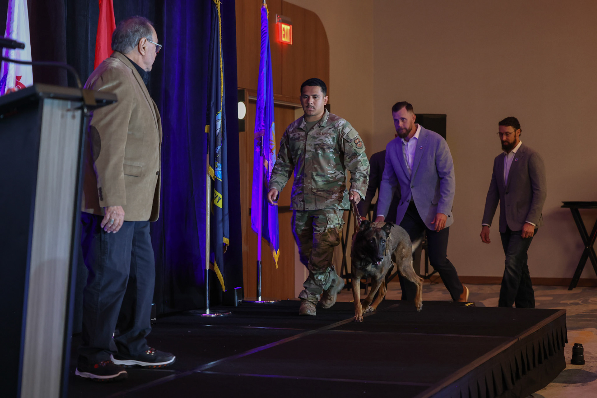 Military working dog Ppuritan receives a medal honoring his retirement from the U.S. Air Force after eight years of service as an explosives detection dog during the U.S. War Dogs Association’s 25th anniversary event Friday, Oct. 17, 2025, at the Plaza San Antonio Hotel &amp; Spa.