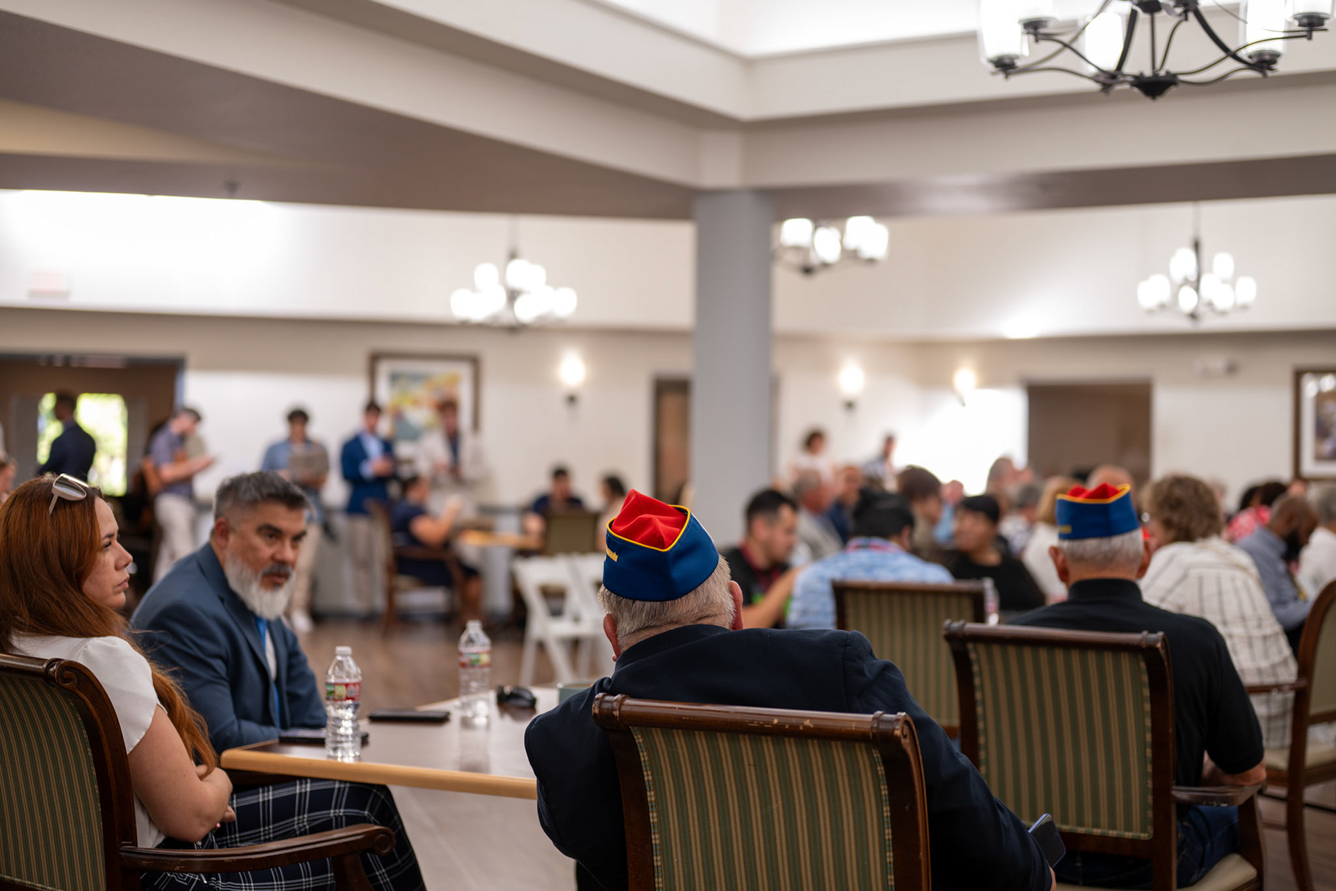 Members of the American GI Forum sit during the ribbon-cutting ceremony for the Valor Hill Apartments on Tuesday, July 29, 2025.