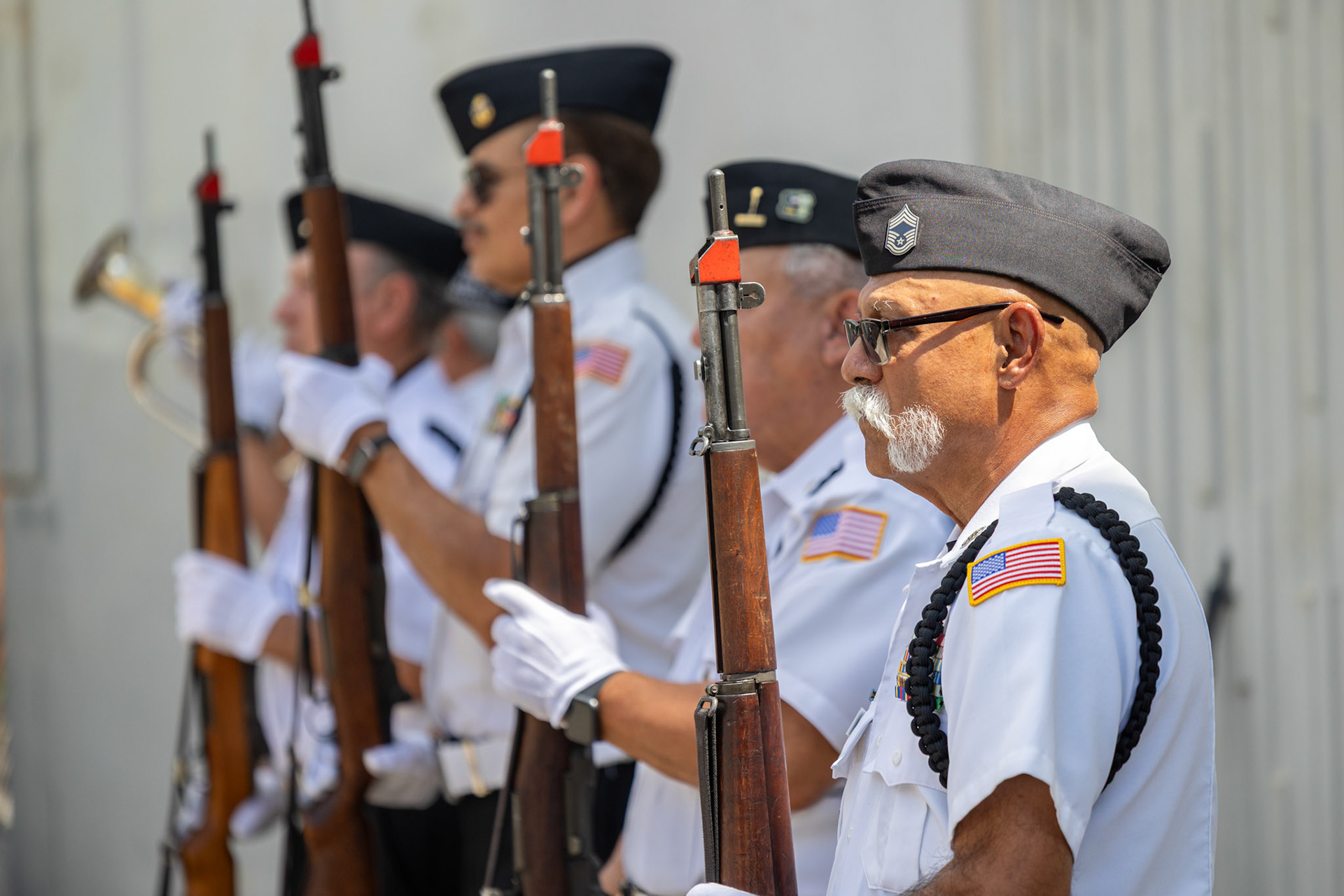The VFW Post 76 Honor Guard presents arms during the playing of taps at the third annual Memorial Flag Ceremony honoring Texas Veteran Suicide Prevention Day on Monday.
