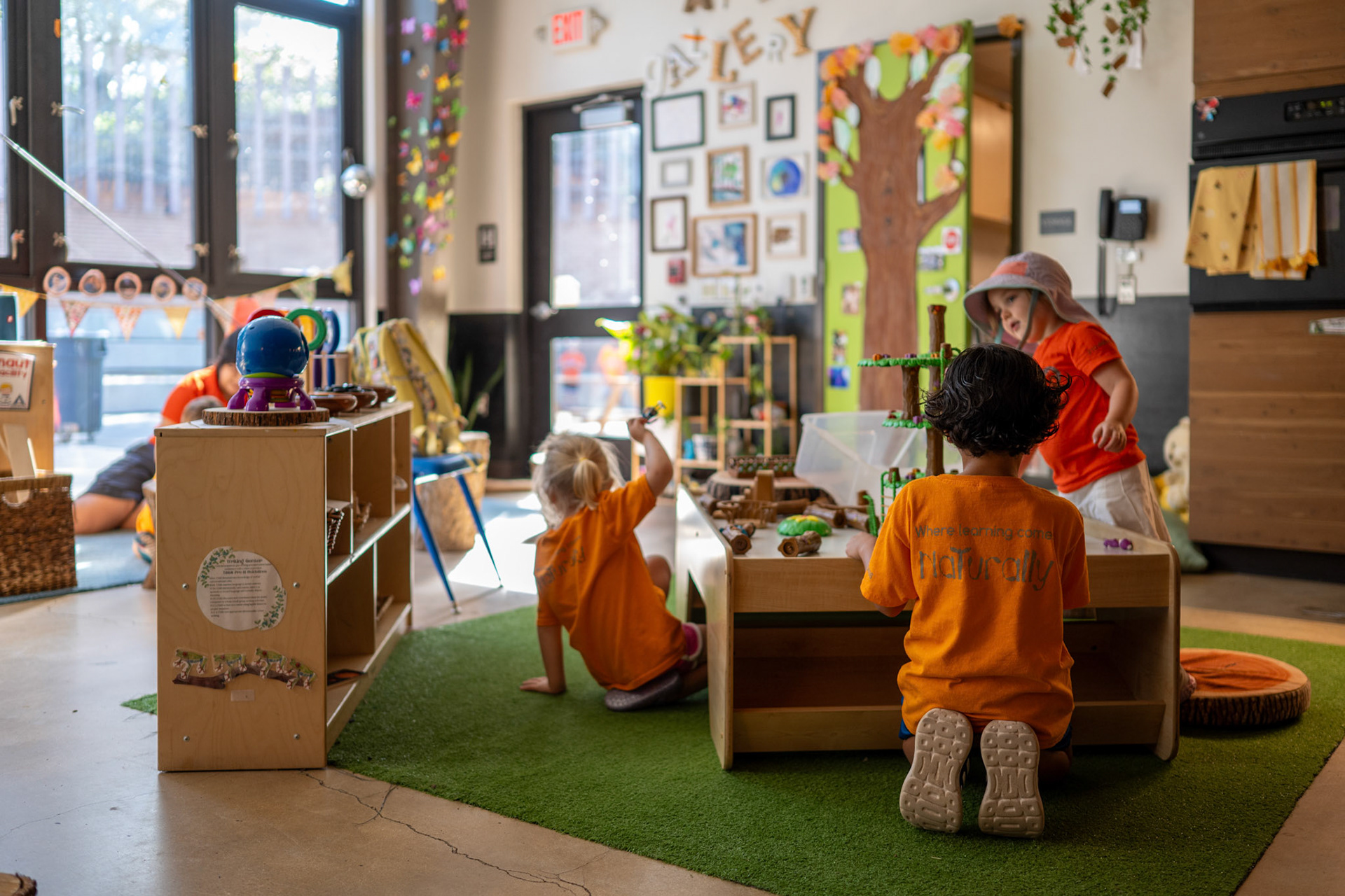 Children play with toys around a table in a classroom at the Will Smith Zoo School in San Antonio on June 17, 2025.