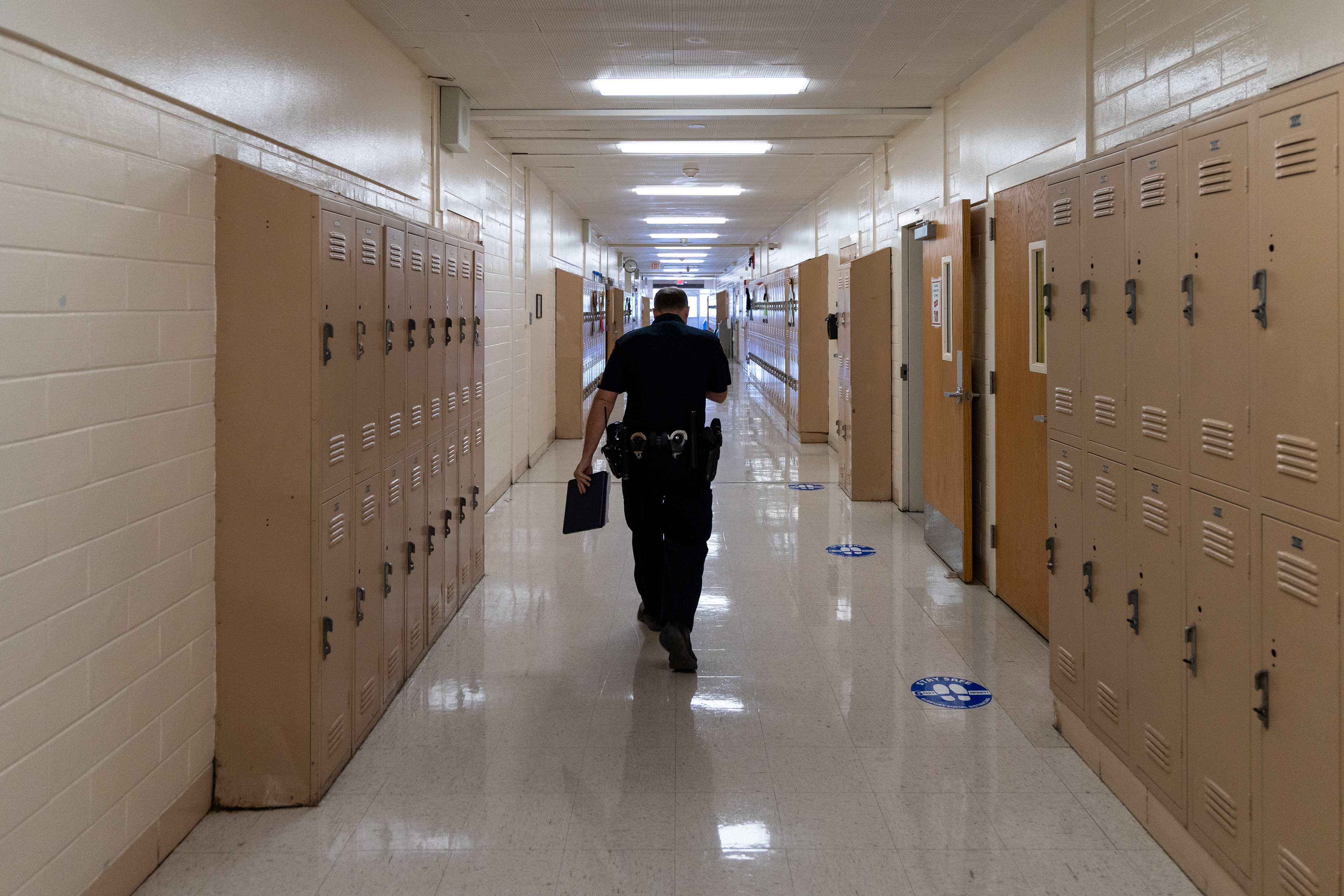 San Antonio Independent School District Police Department Sgt. Joshua Bodenbach walks through the halls of the Copper Learning Center on Sept. 11, 2025.
