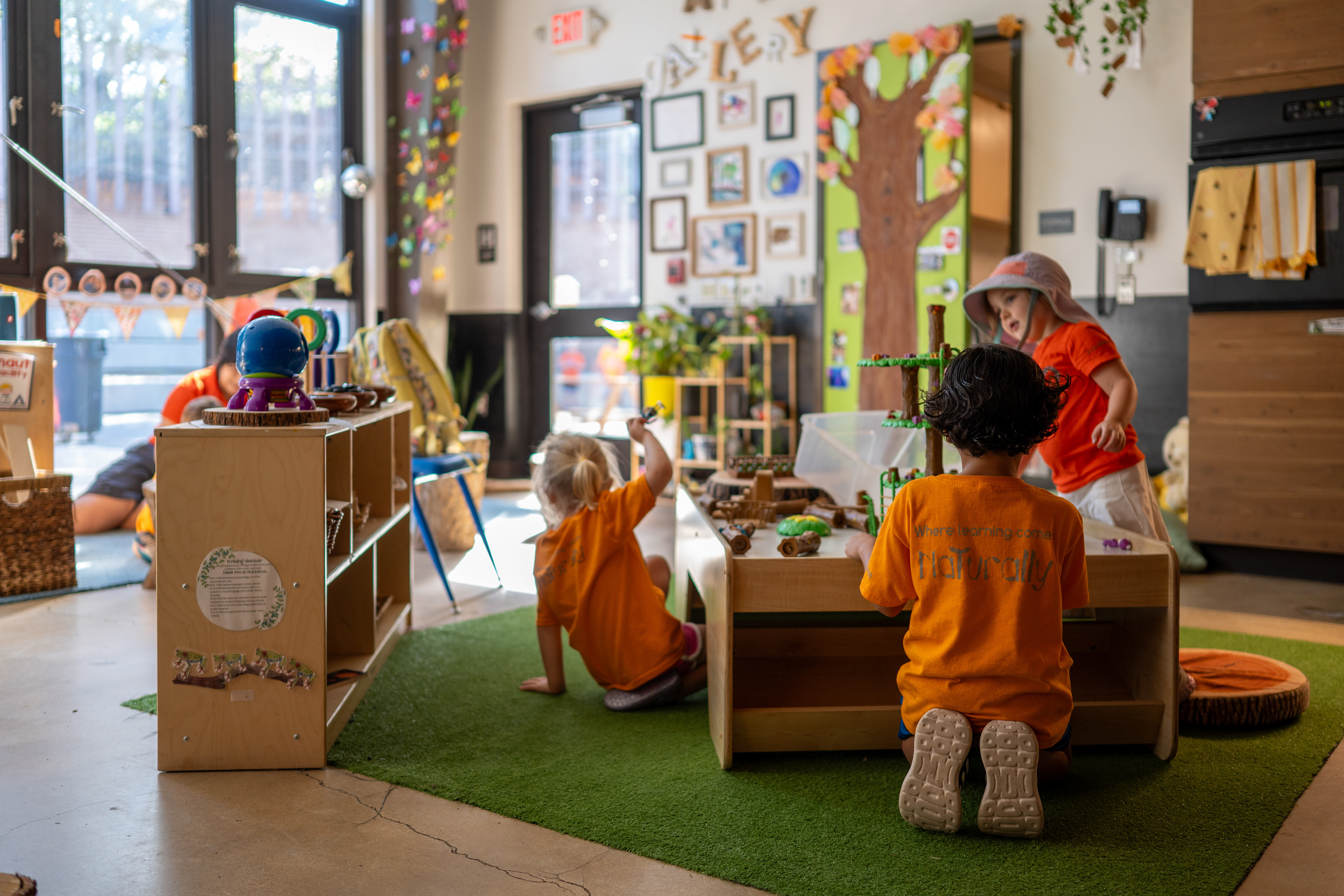 Children play with toys around a table in a classroom at the Will Smith Zoo School in San Antonio on June 17, 2025. 