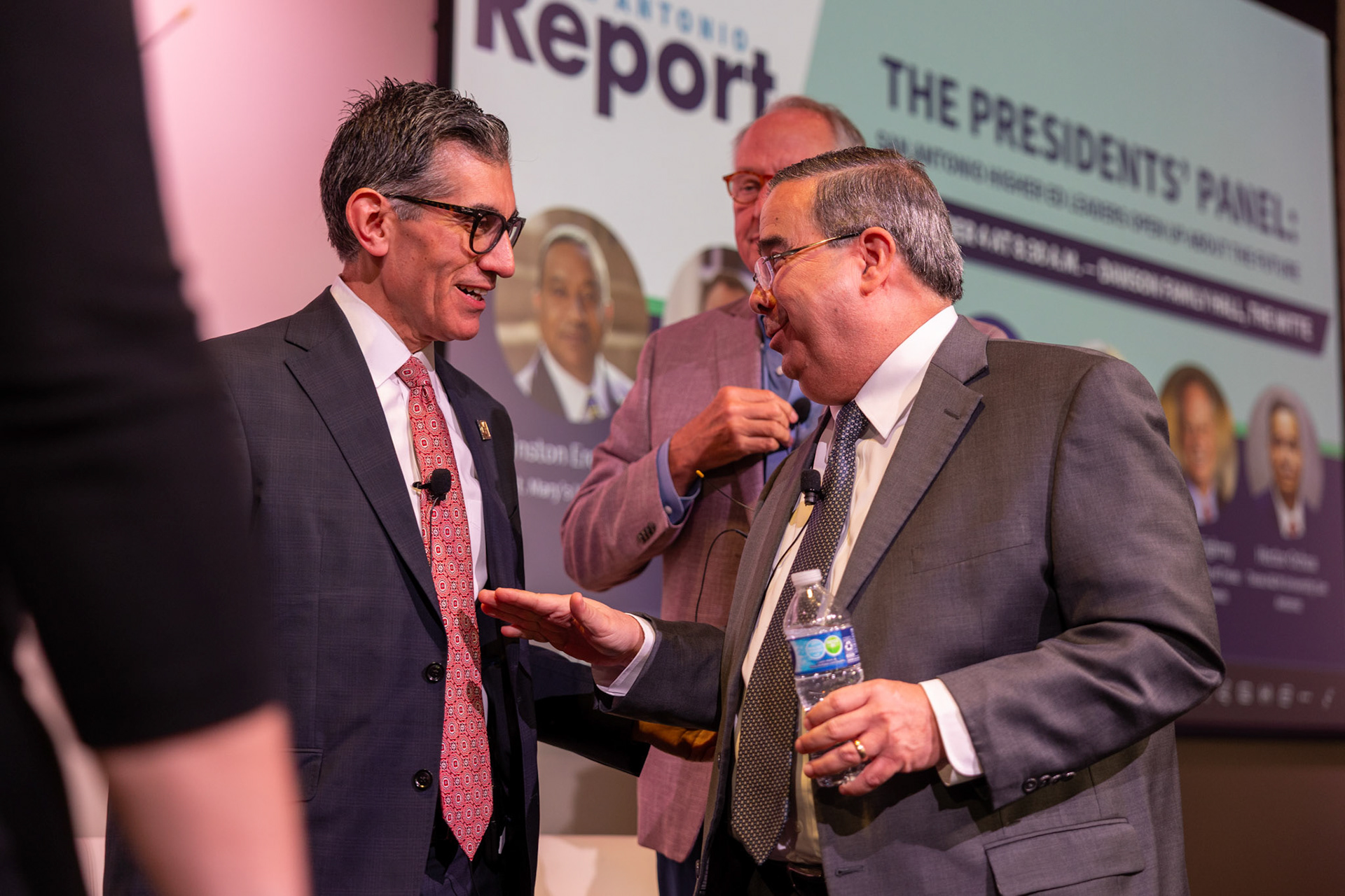Alamo Colleges District Chancellor Mike Flores speaks with Texas A&amp;M University–San Antonio President Hector Ochoa during the Presidents Panel on Sept. 9, 2025, in San Antonio.