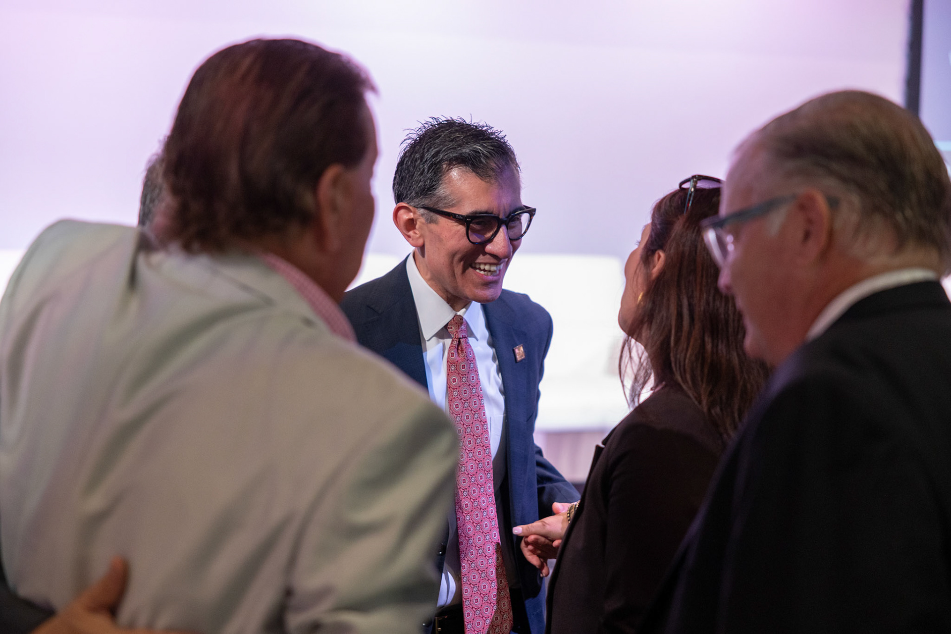 Alamo Colleges District Chancellor Mike Flores mingles with the crowd during the Presidents Panel on Sept. 9, 2025, in San Antonio.