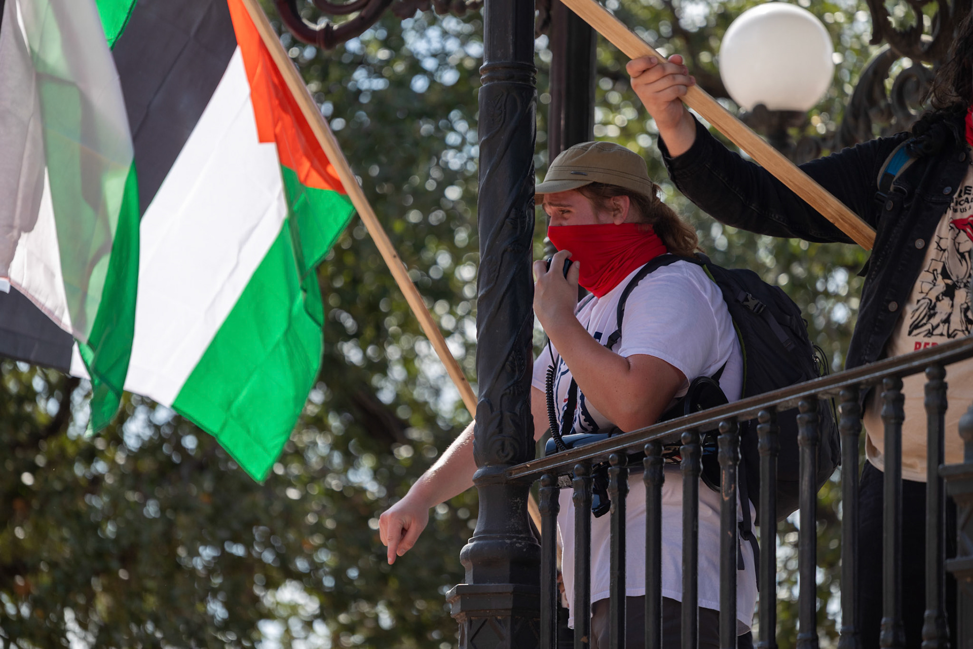 An organizer speaks during a planned protest at Milam Park on Oct. 7, 2025, in San Antonio.