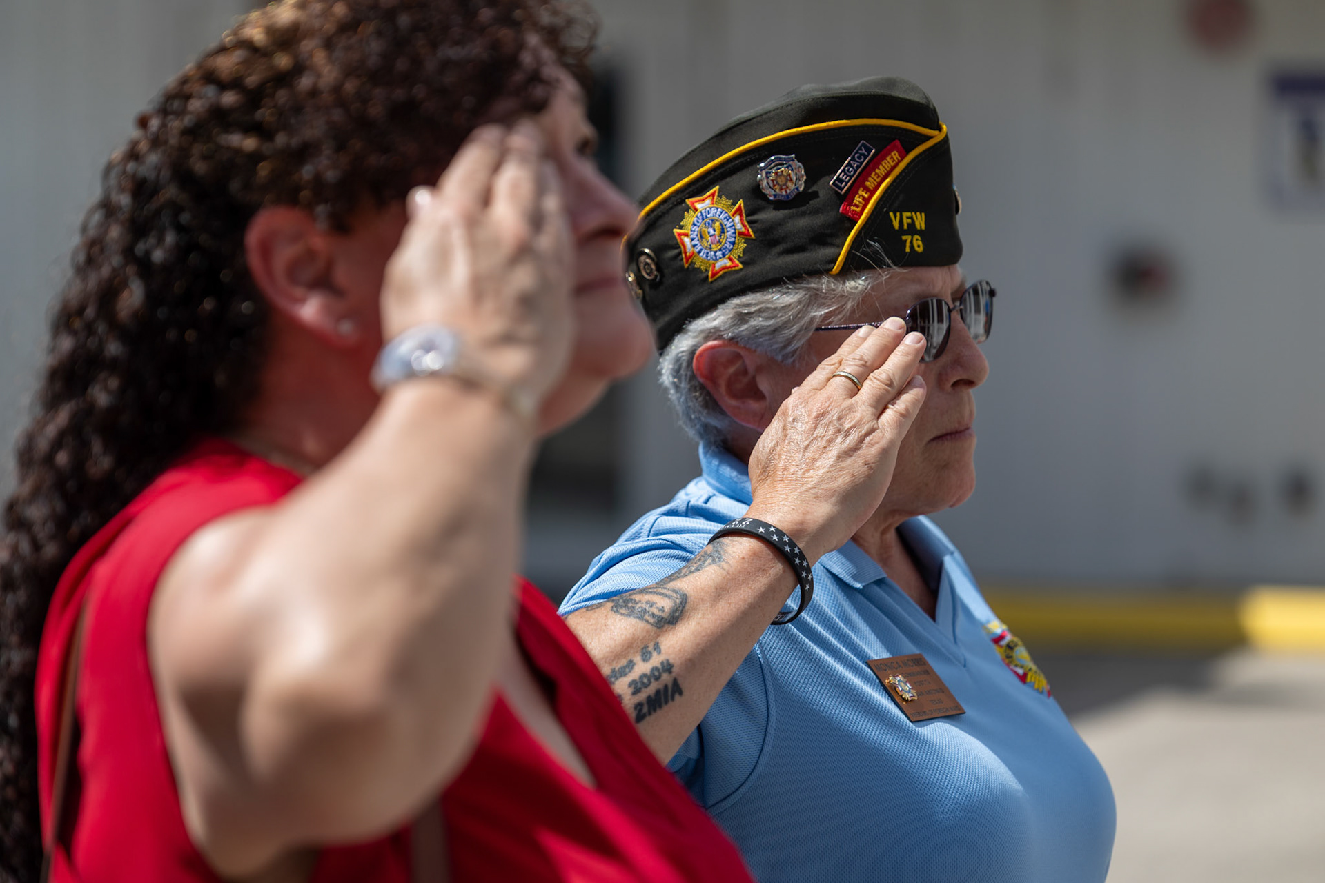 VFW Post 76 commander Monica Morris salutes during the playing of taps at the third annual Memorial Flag Ceremony honoring Texas Veteran Suicide Prevention Day on Monday.