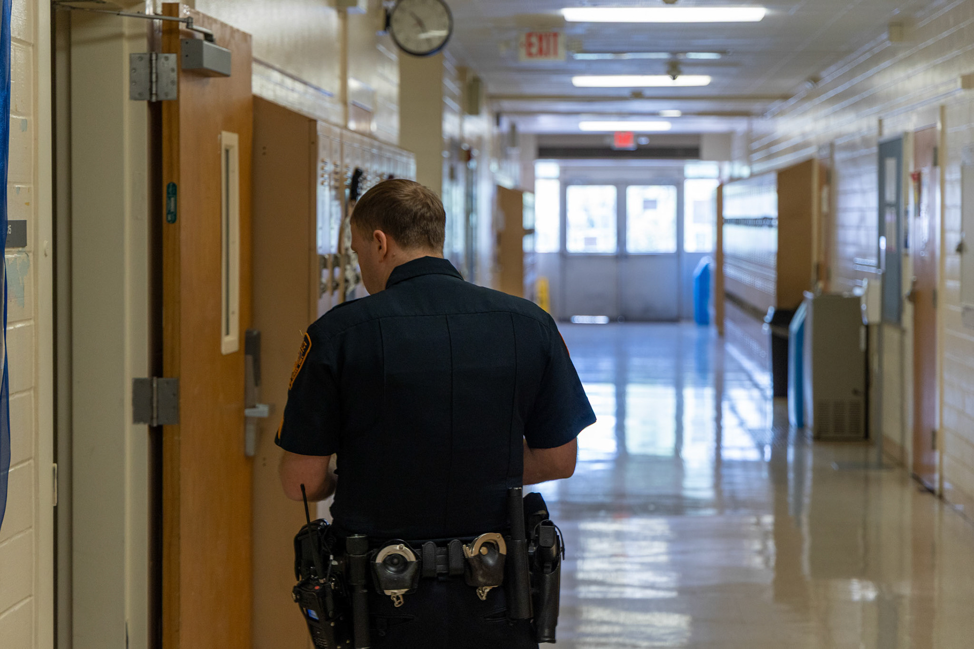 San Antonio Independent School District Police Department Sgt. Joshua Bodenbach walks through the halls of the Copper Learning Center  on Sept. 11, 2025.