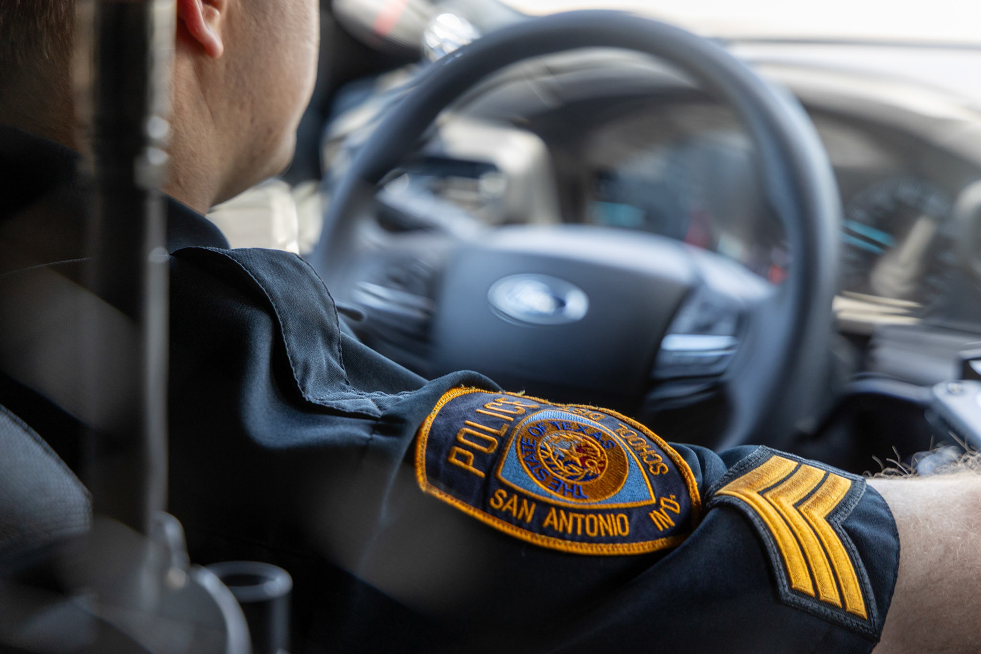 The San Antonio Independent School District Police Department patch on the uniform of Sgt. Joshua Bodenbach in his patrol vehicle on Sept. 11, 2025.