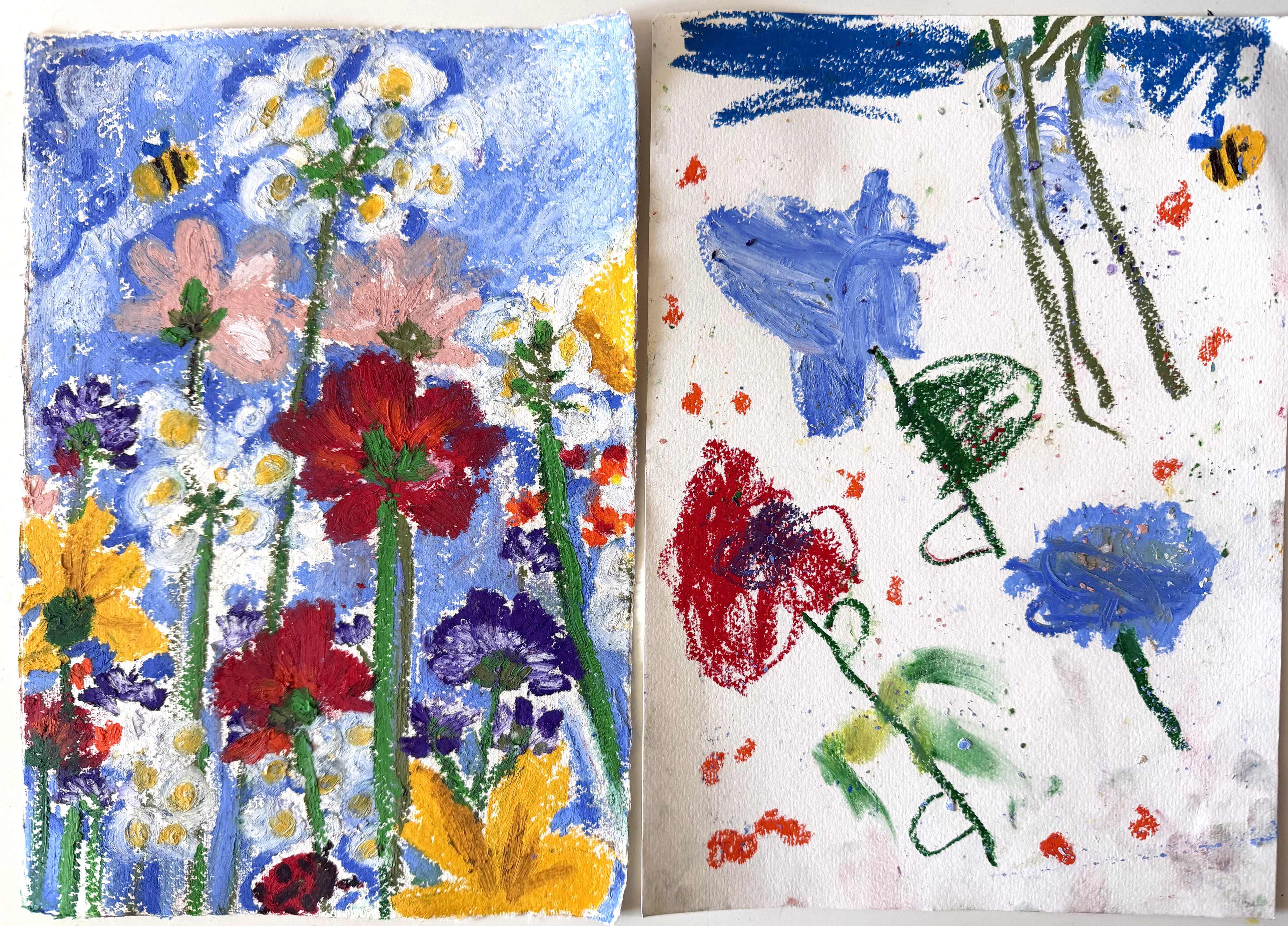 Oil pastel flower drawings side by side with my five year old daughter