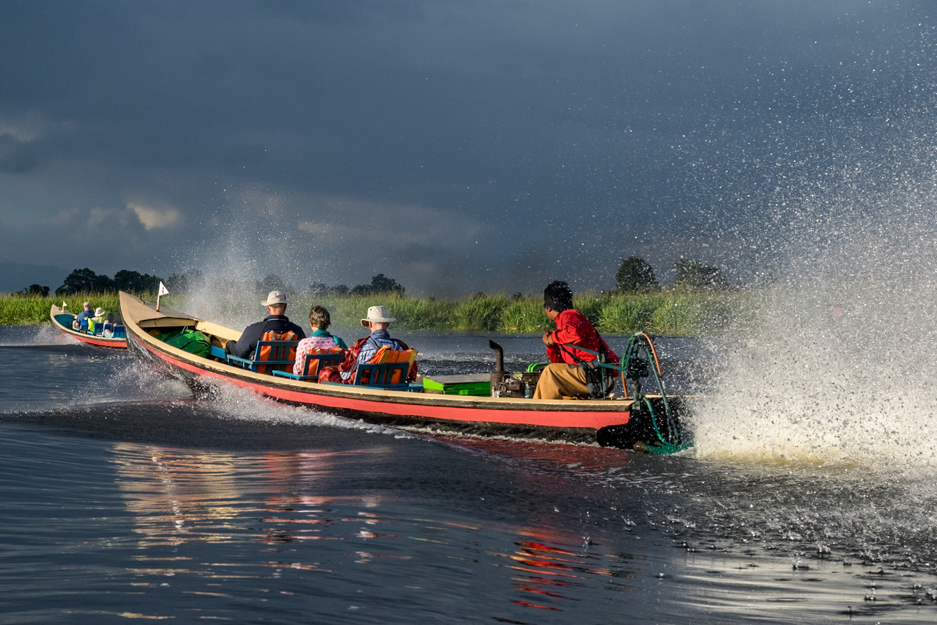 Speeding along in boats, Inle Lake (InsideAsia East magazine)