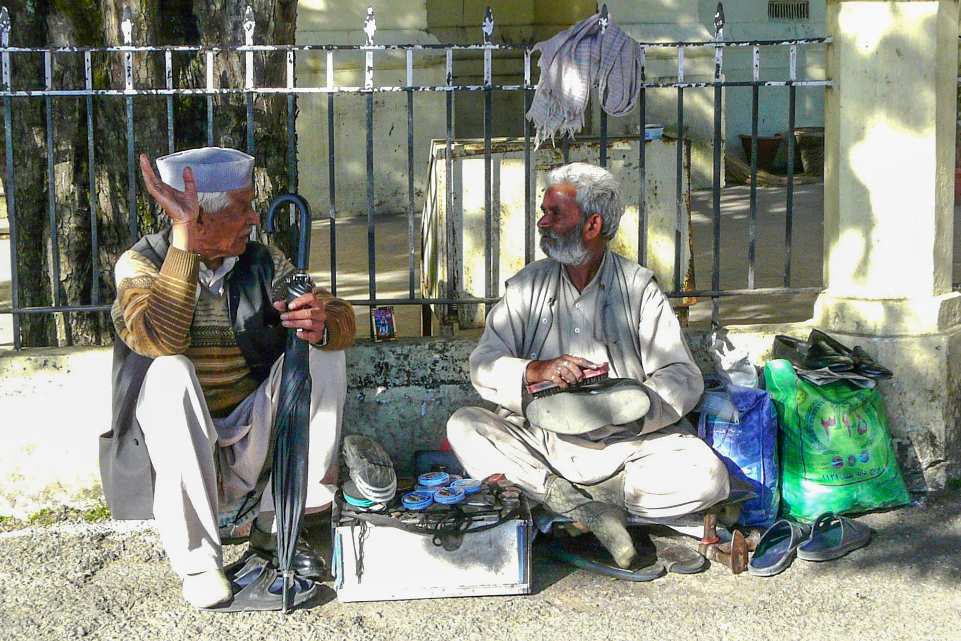Shoe cleaner with friend, Shimla, India, 2012