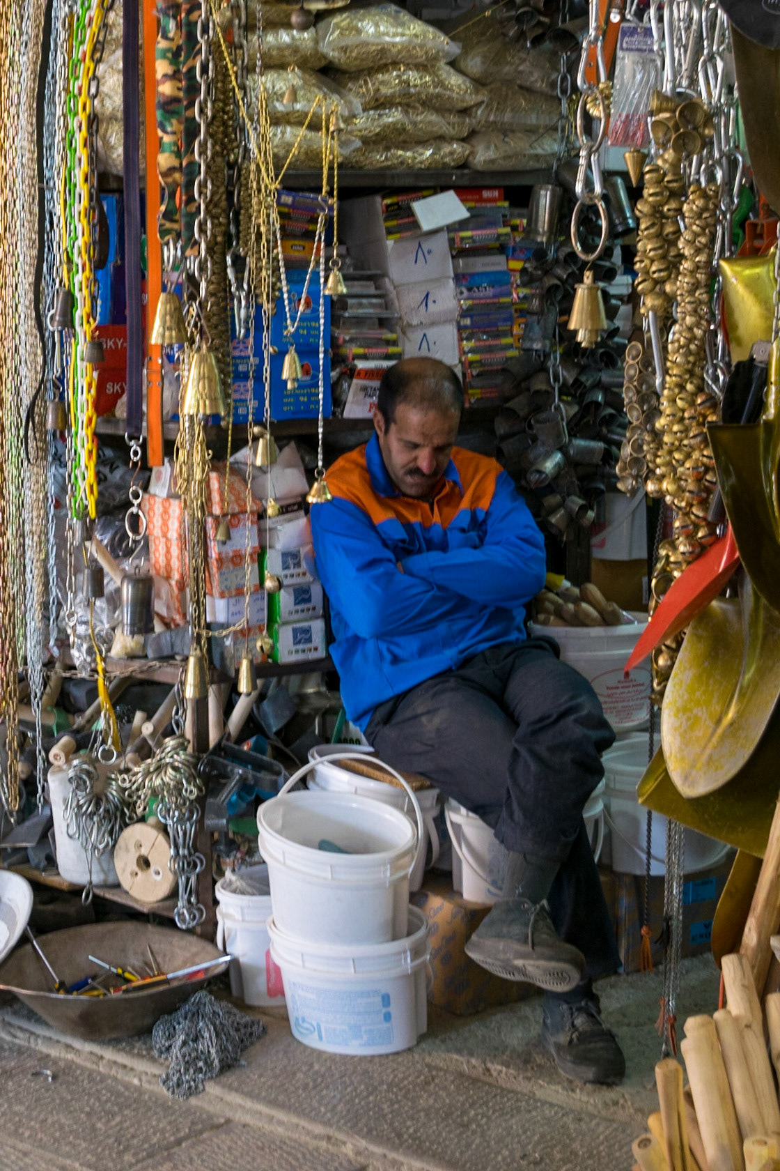 Sleepy shopkeeper, Isfahan, Iran
