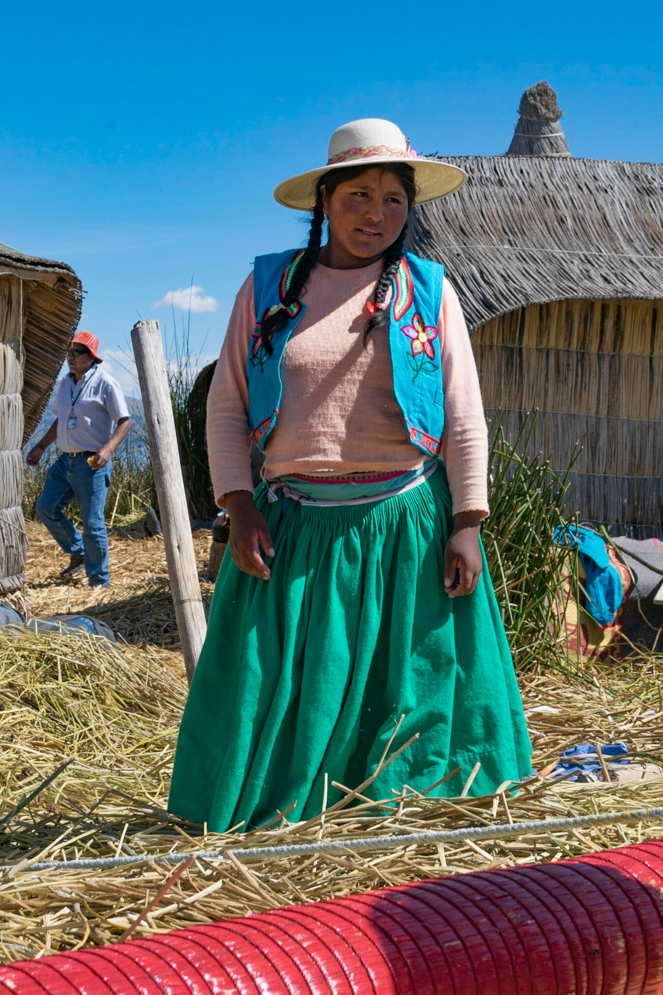 Young girl on floating island, Lake Titicaca, Peru