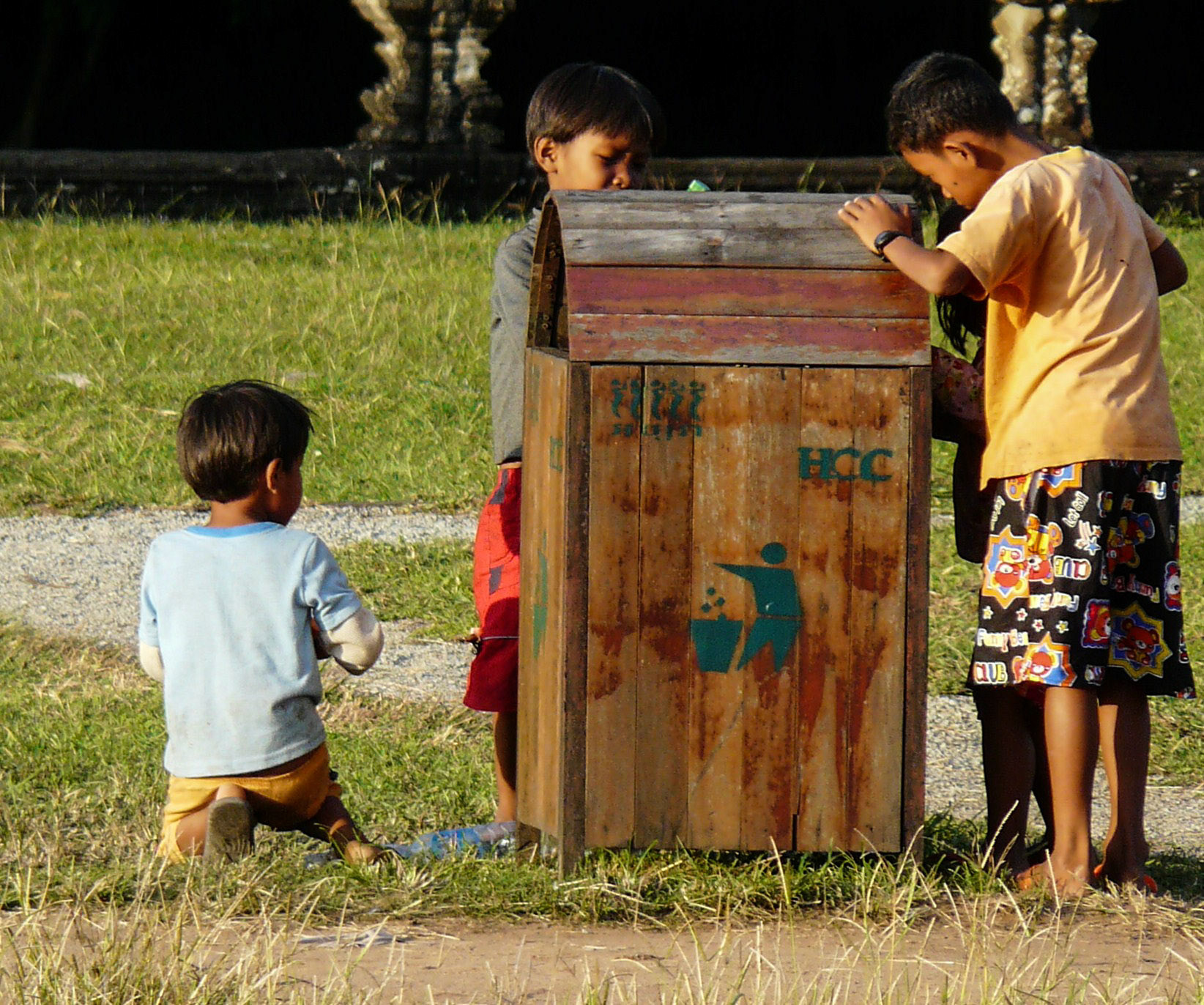 Children looking for bottles to recycle, Angkor Wat, Siem Reap, Cambodia
