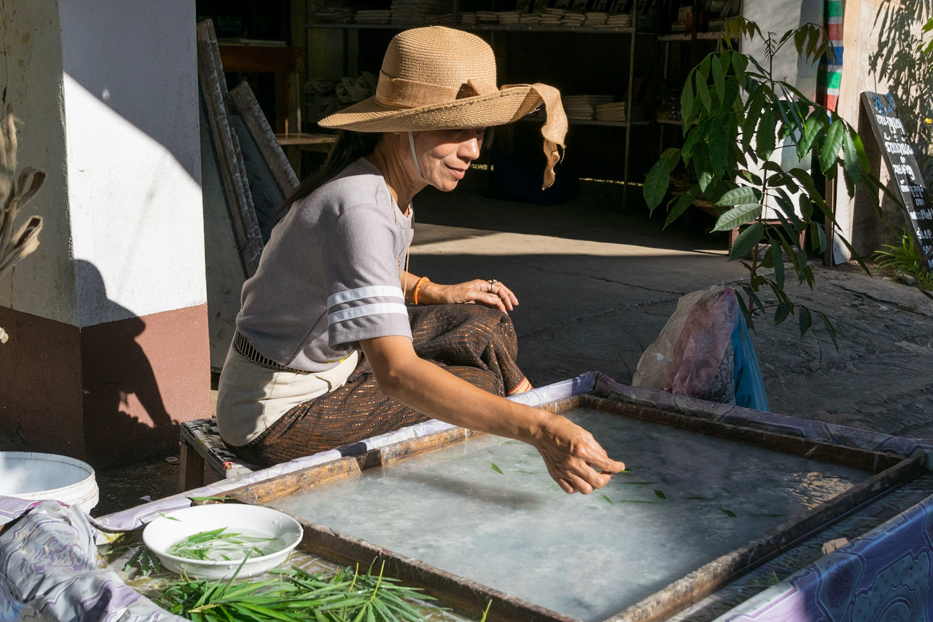 Lady making paper, near Luang Prabang