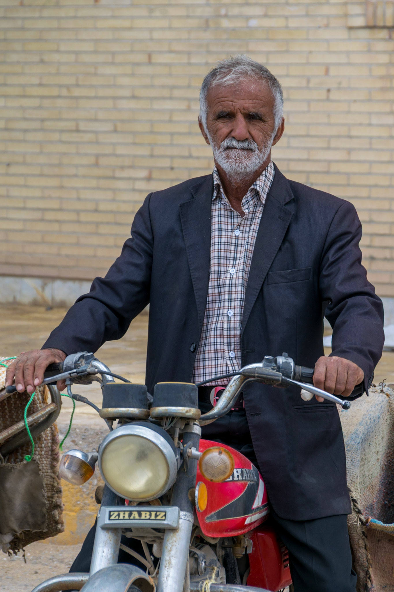 Man on motorbike, Kharanaq, Iran