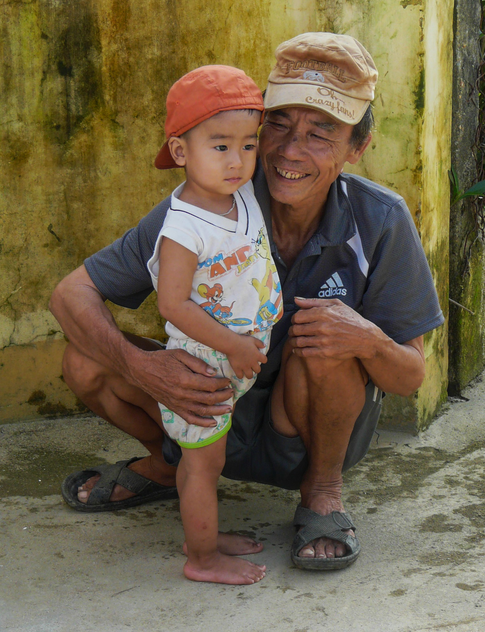 Elderly man with young boy, near Hoi An, Vietnam, 2013