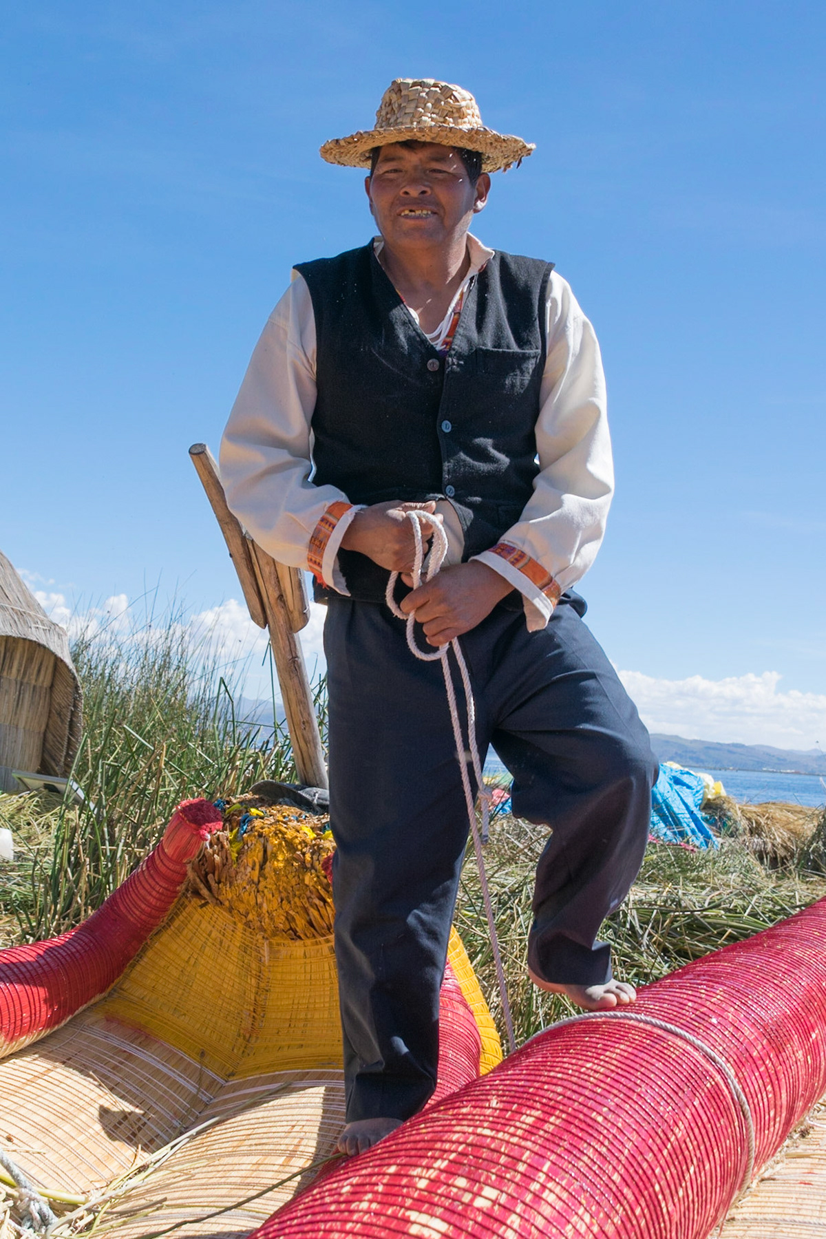 Family elder on floating island, Lake Titicaca, Peru