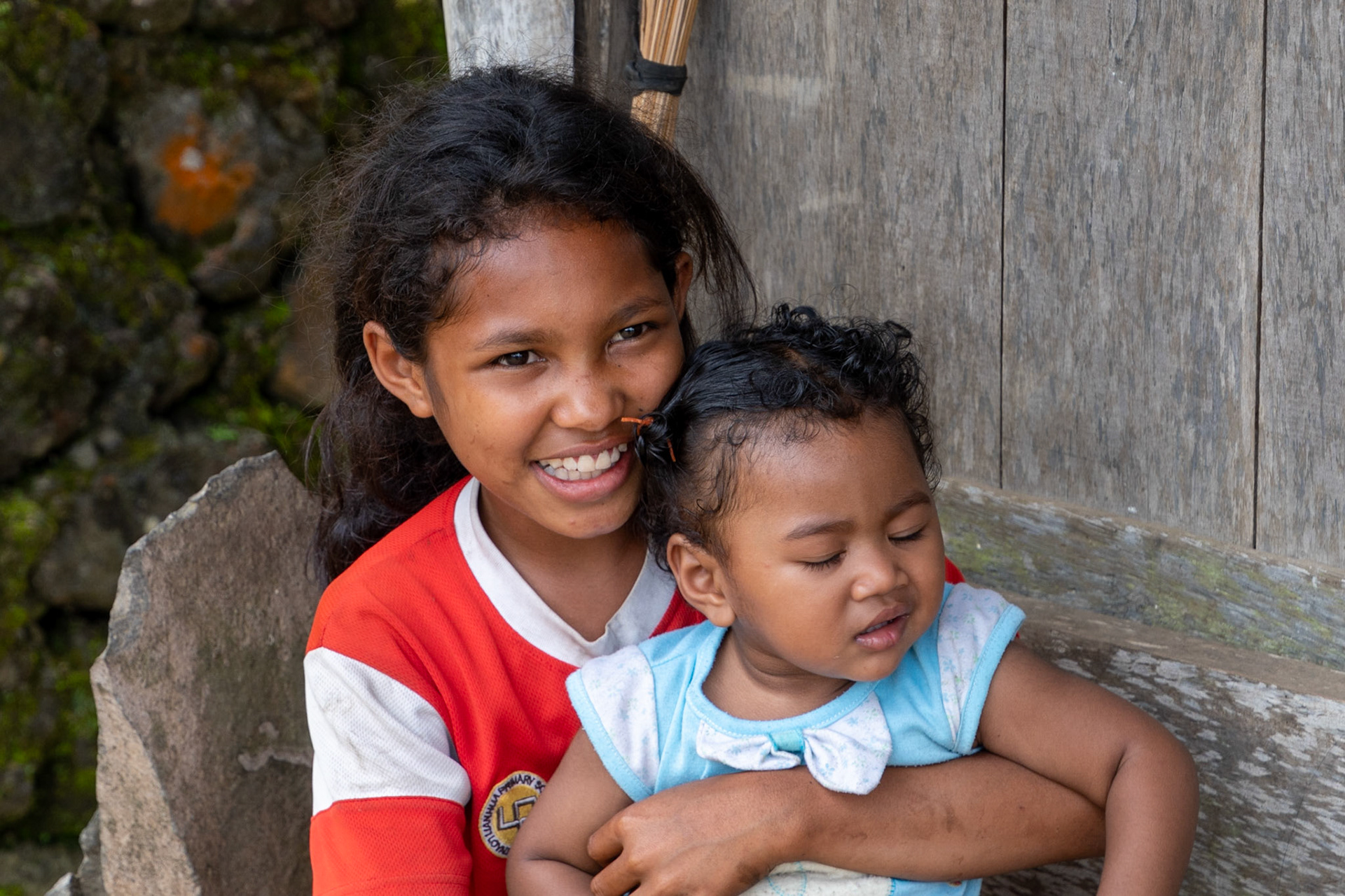 Young girl with child, Luba Village, Flores, Indonesia, 2022