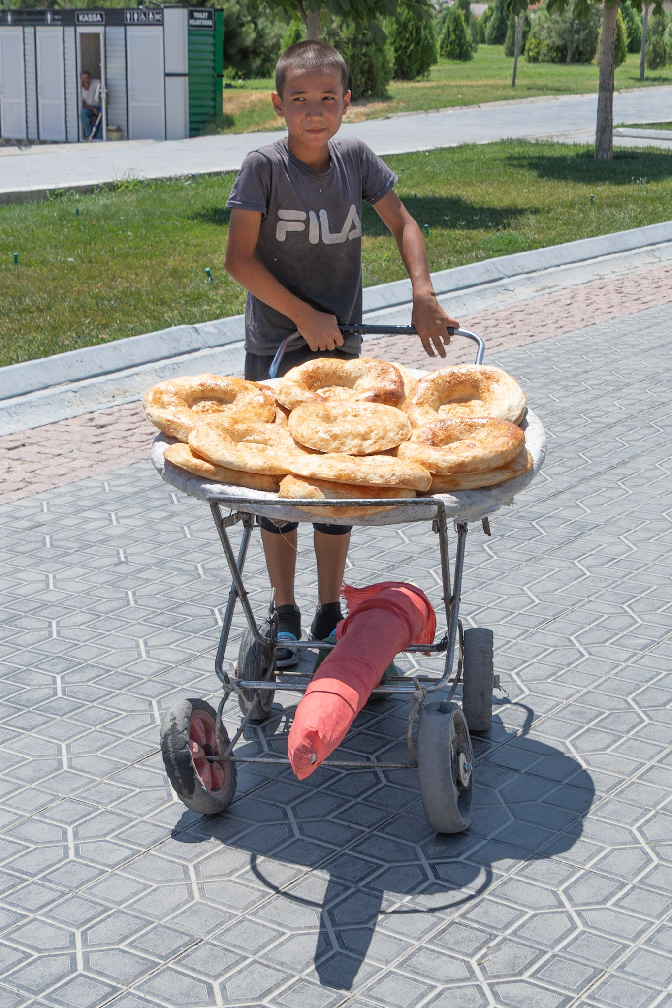 Boy selling bread, Samarkand, Uzbekistan