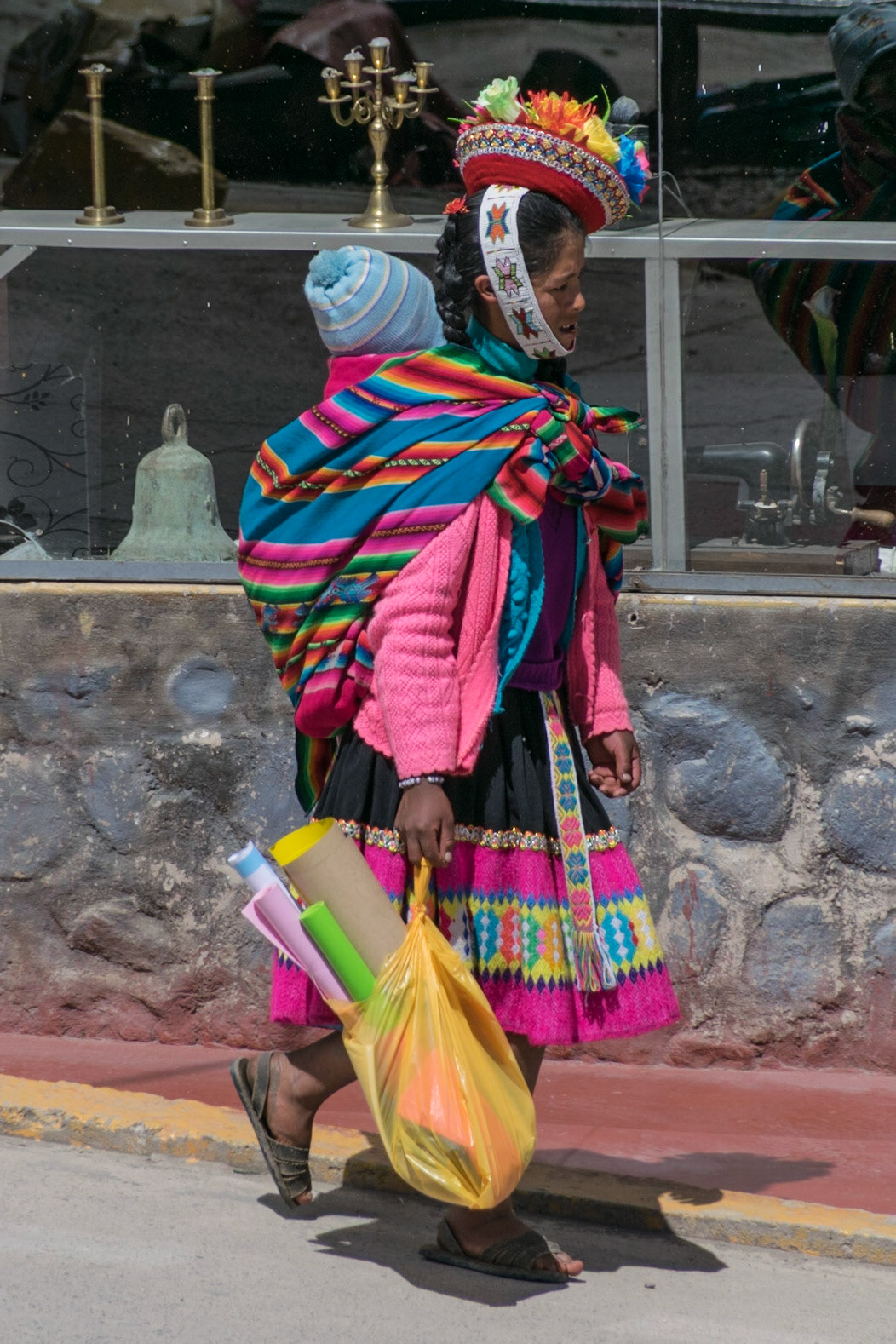 Colourful lady with baby, Ollantaytambo, Peru