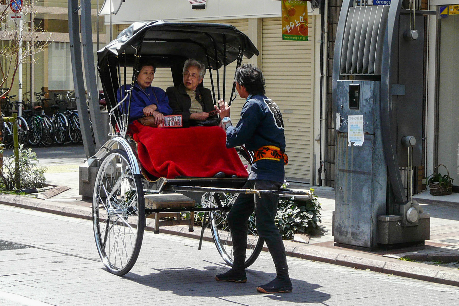 Two ladies in a rikshaw, Tokyo, Japan, 2010