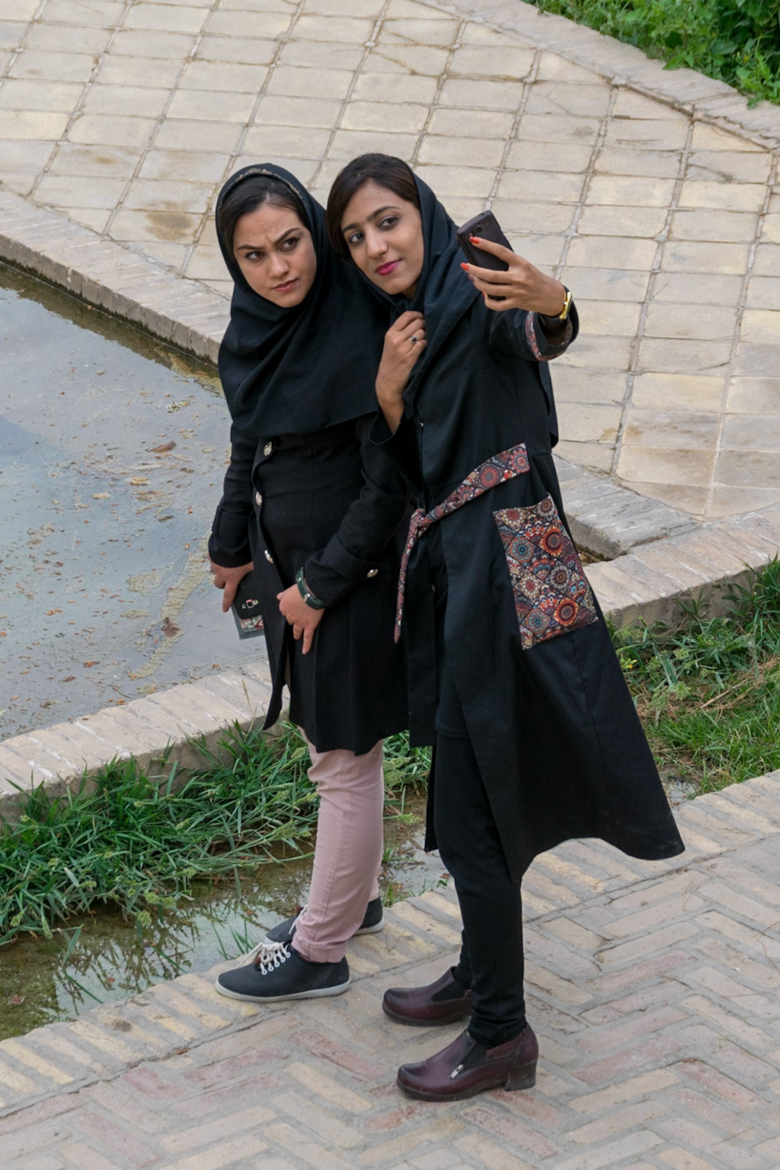 Two girls taking selfie, Yazd, Iran