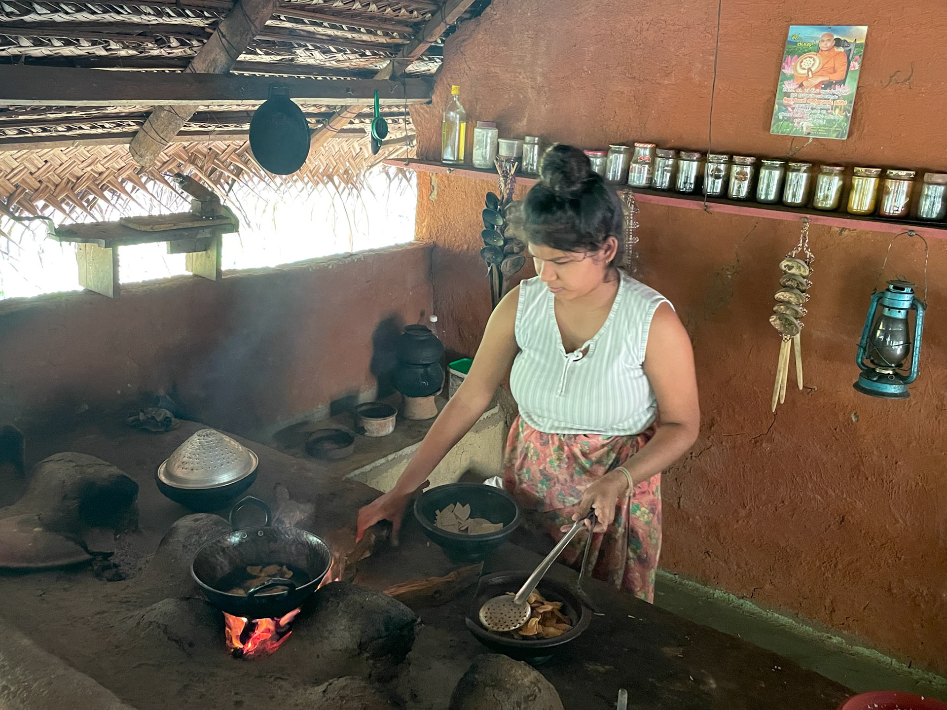 Lady demonstrating cooking, Sigiriya, Sri Lanka