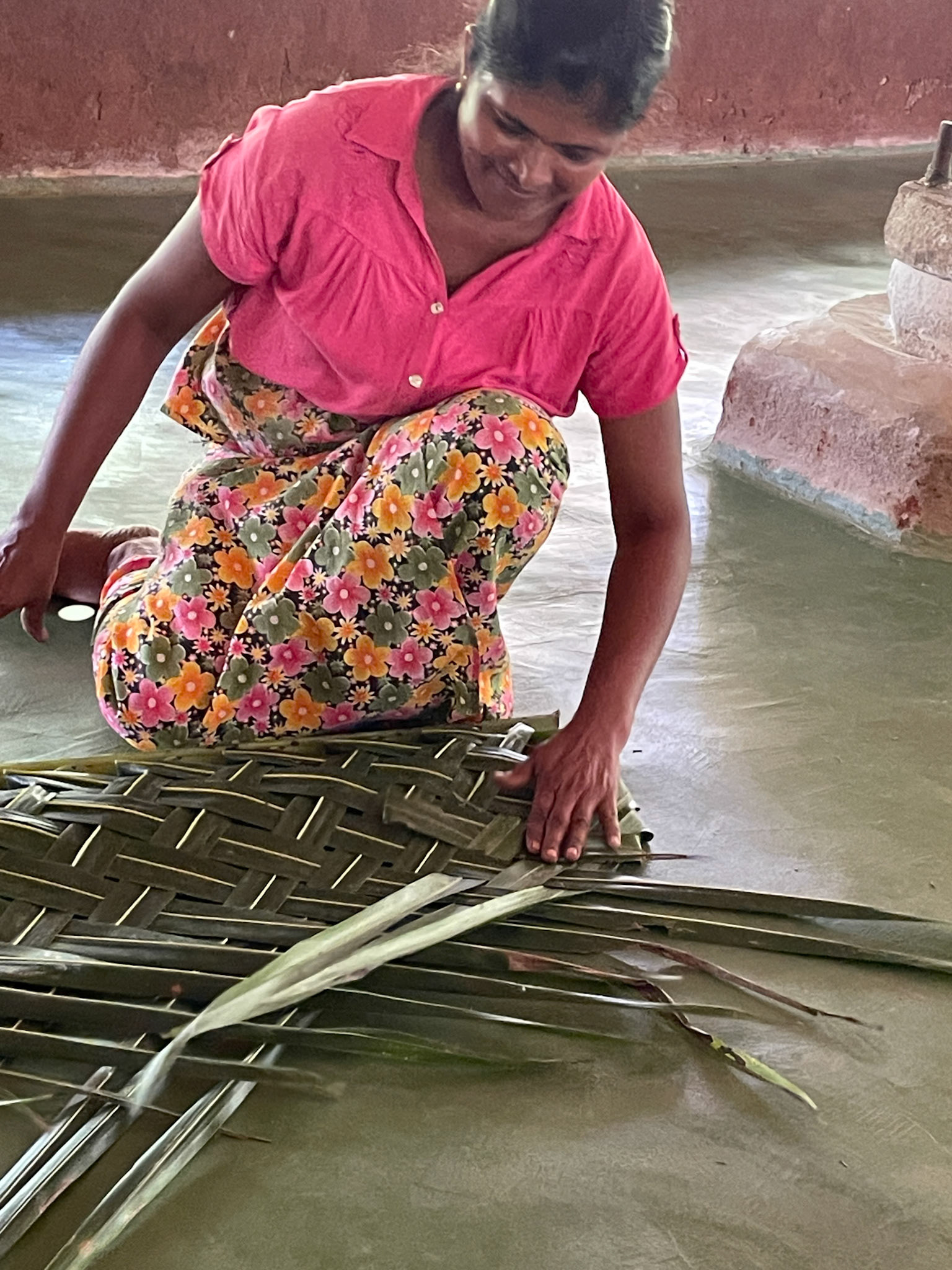Lady weaving palm leaves, Sigiriya, Sri Lanka