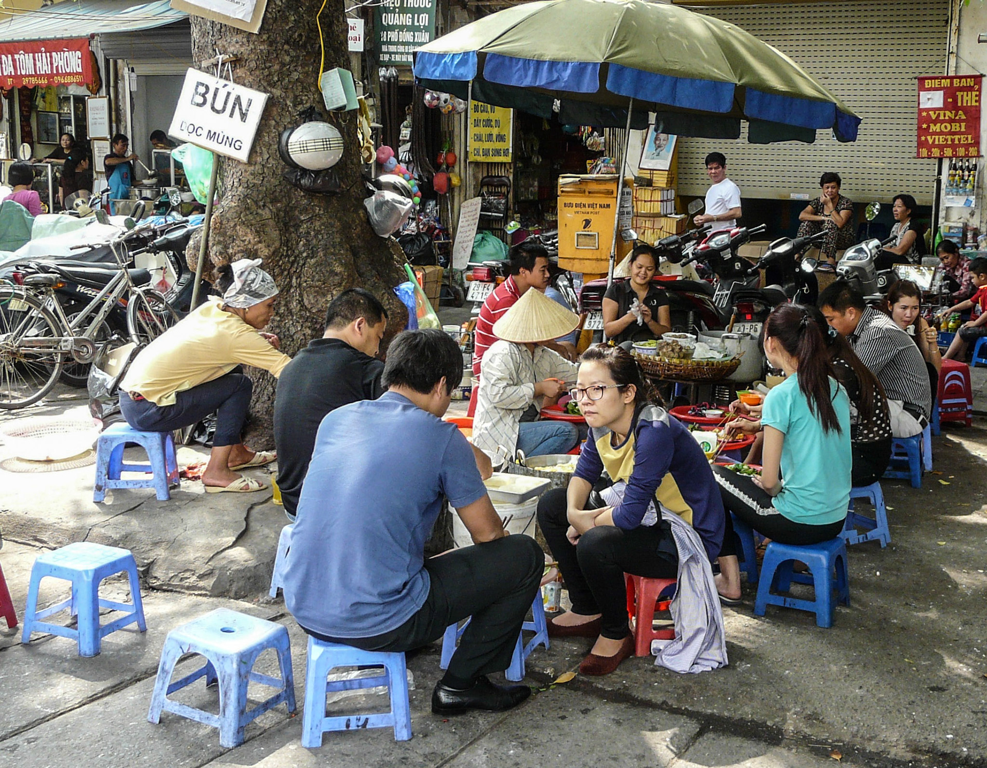 Customers at street cafe, Hanoi, Vietnam