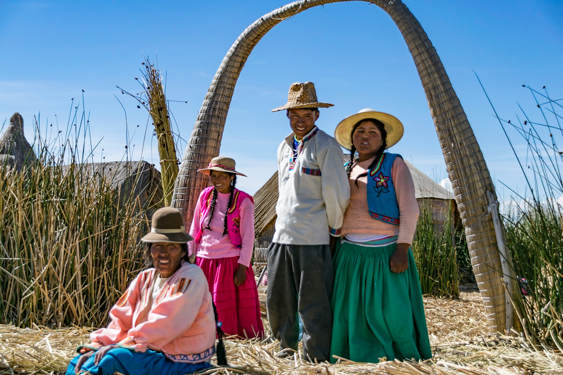Family bidding farewell, Floating island, Lake Titicaca, Peru