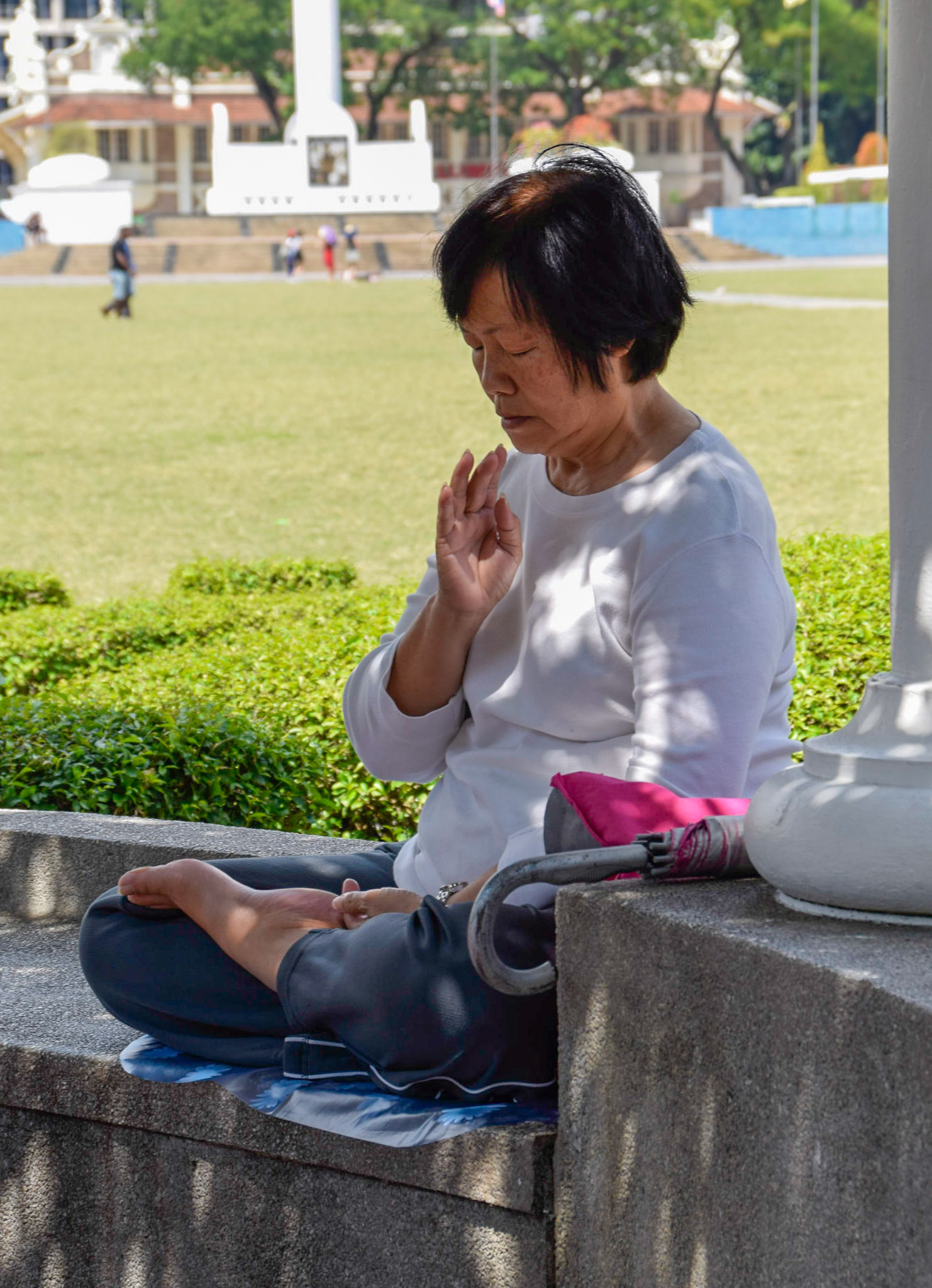 Lady meditating, Kuala Lumpur, Malaysia