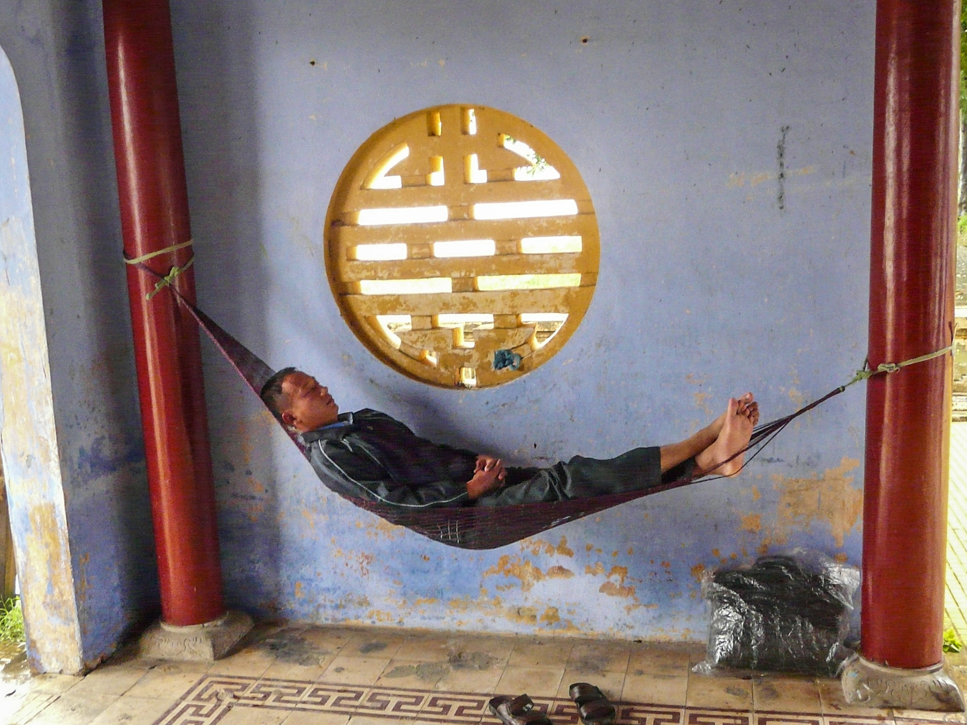 Man in hammock, Hue, Vietnam, 2013