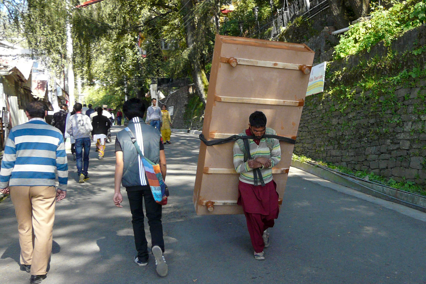 Man carrying bed on his back, Shimla, India