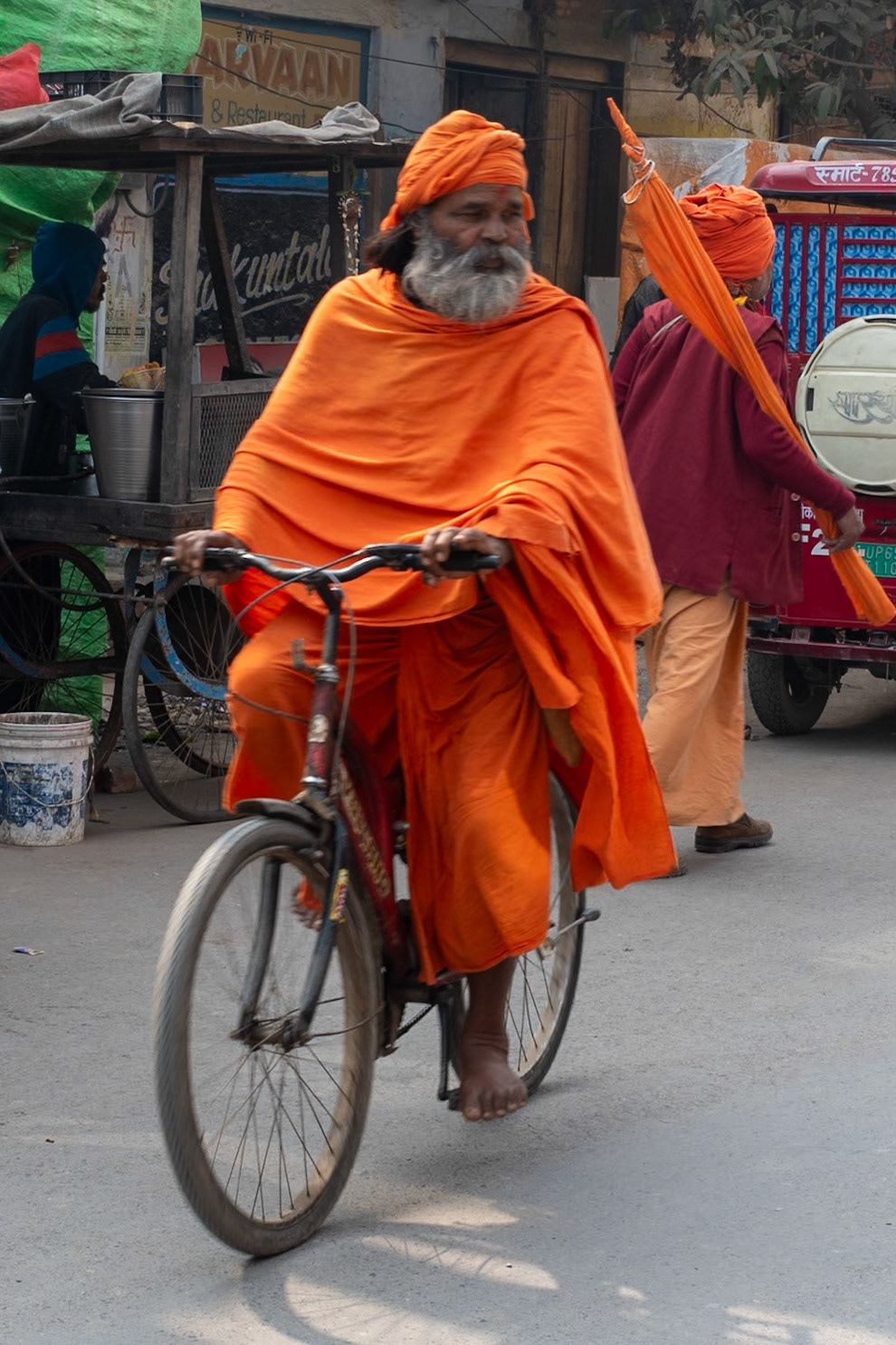 Pilgrim on a bike, Varanasi, India, 2024