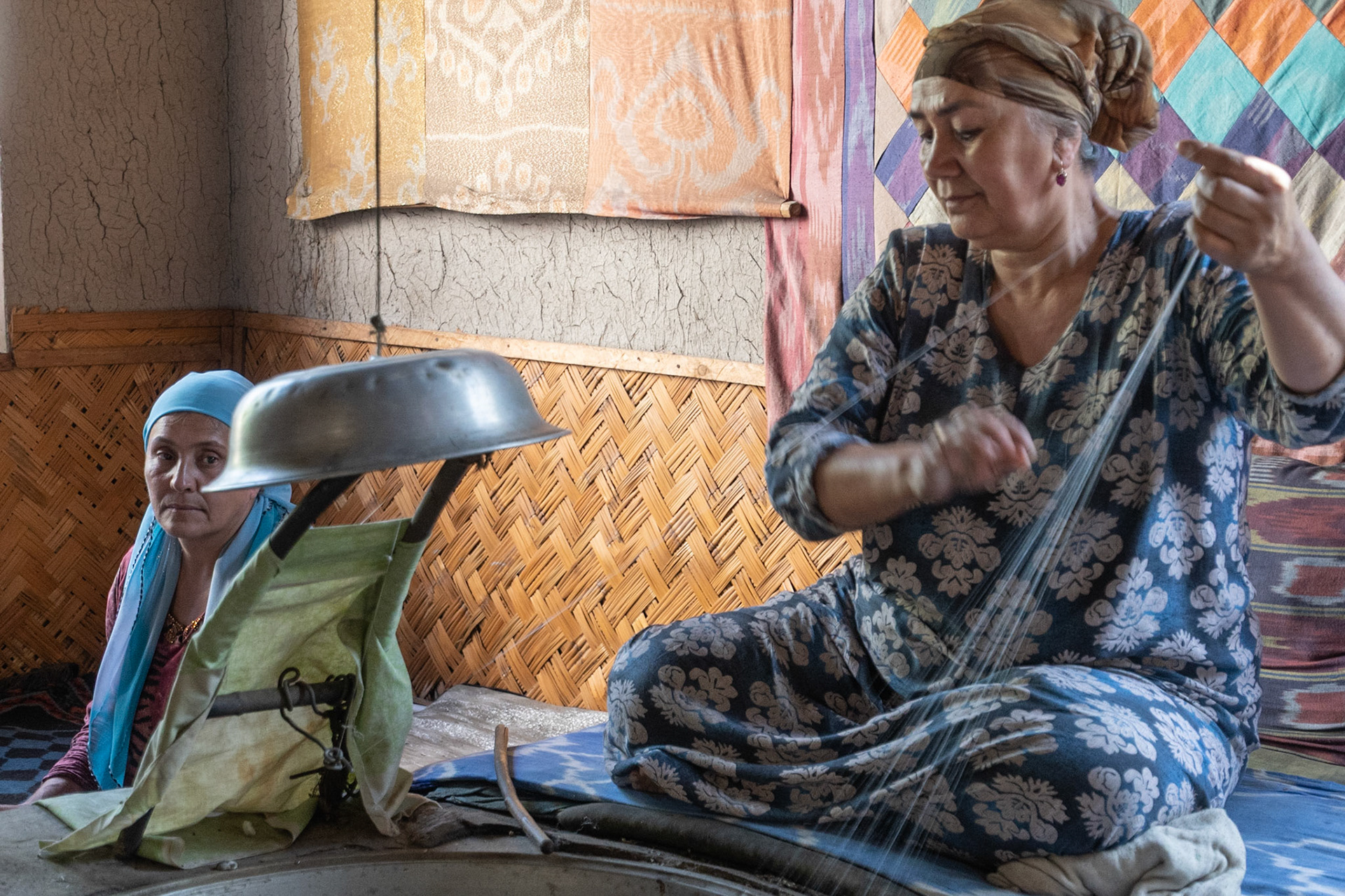 Lady spinning silk, Margilan, Uzbekistan, 2019